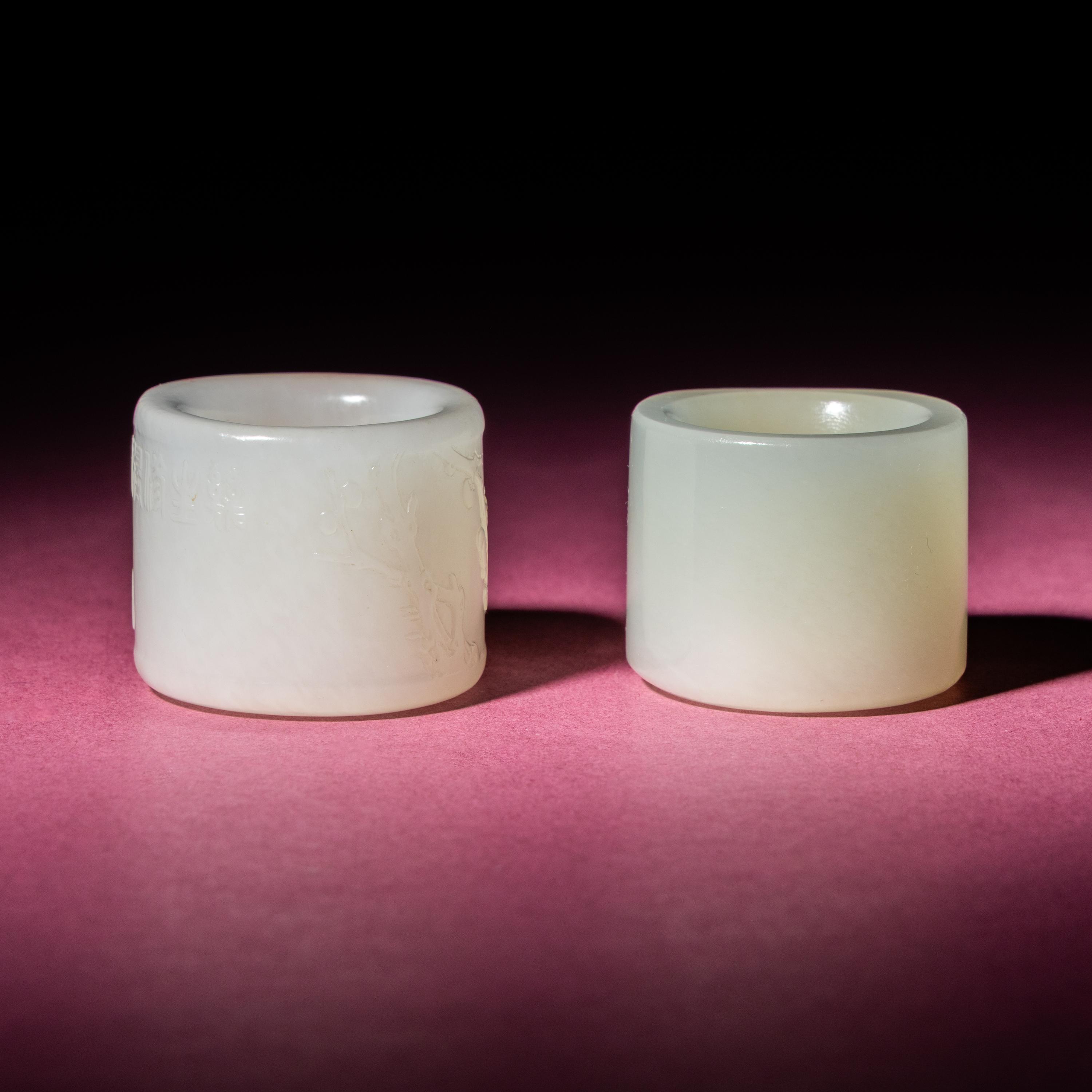 Two Chinese Jade Archer's Rings, 18th/19th Century — 清中期 白玉留皮扳指兩枚