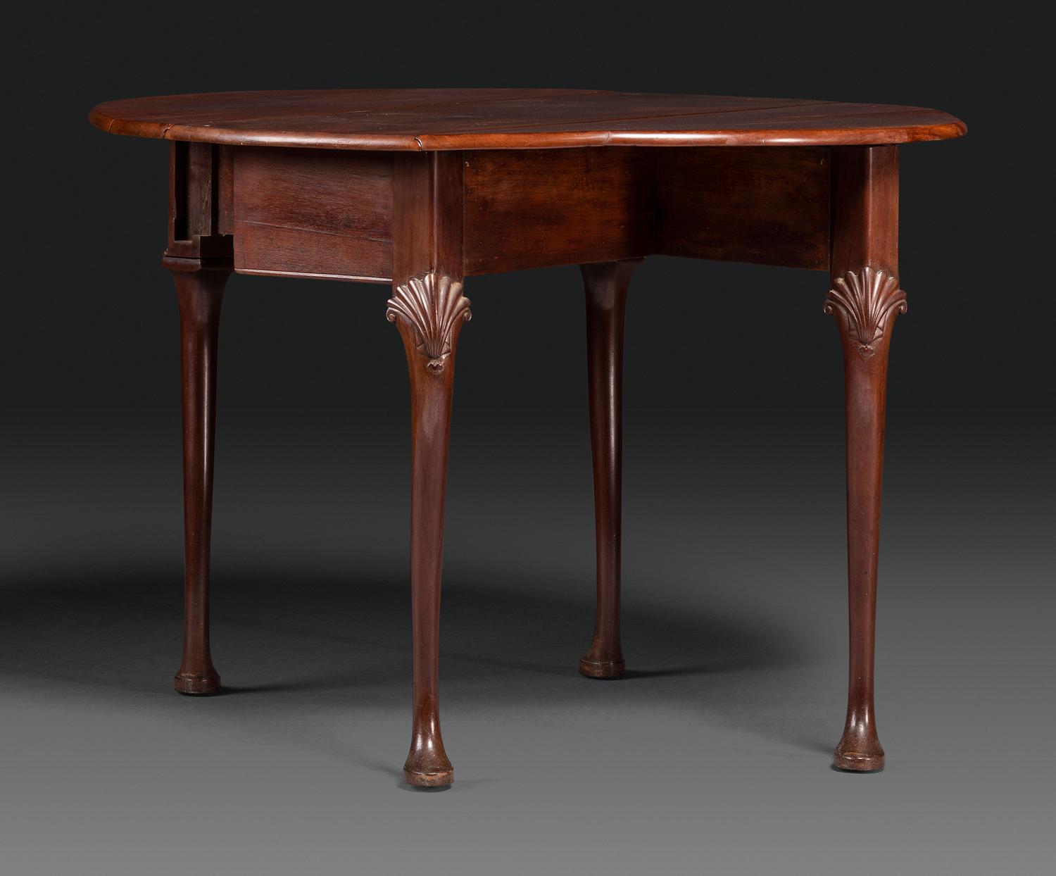 A Queen Anne Shell-Carved Mahogany Drop-Leaf Table