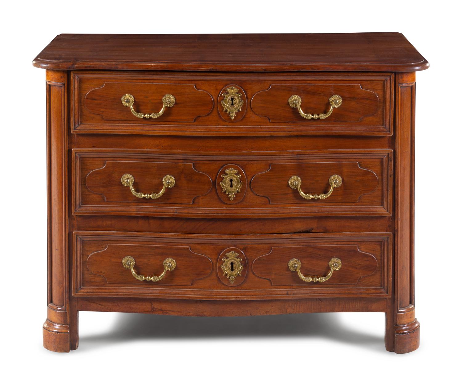 A Régence Gilt Metal Mounted Carved Walnut Serpentine Commode
