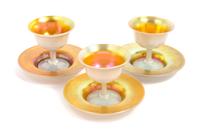 Steuben, EARLY 20TH CENTURY, a set of eight Aurene sherberts and under plates, in gold iridescence