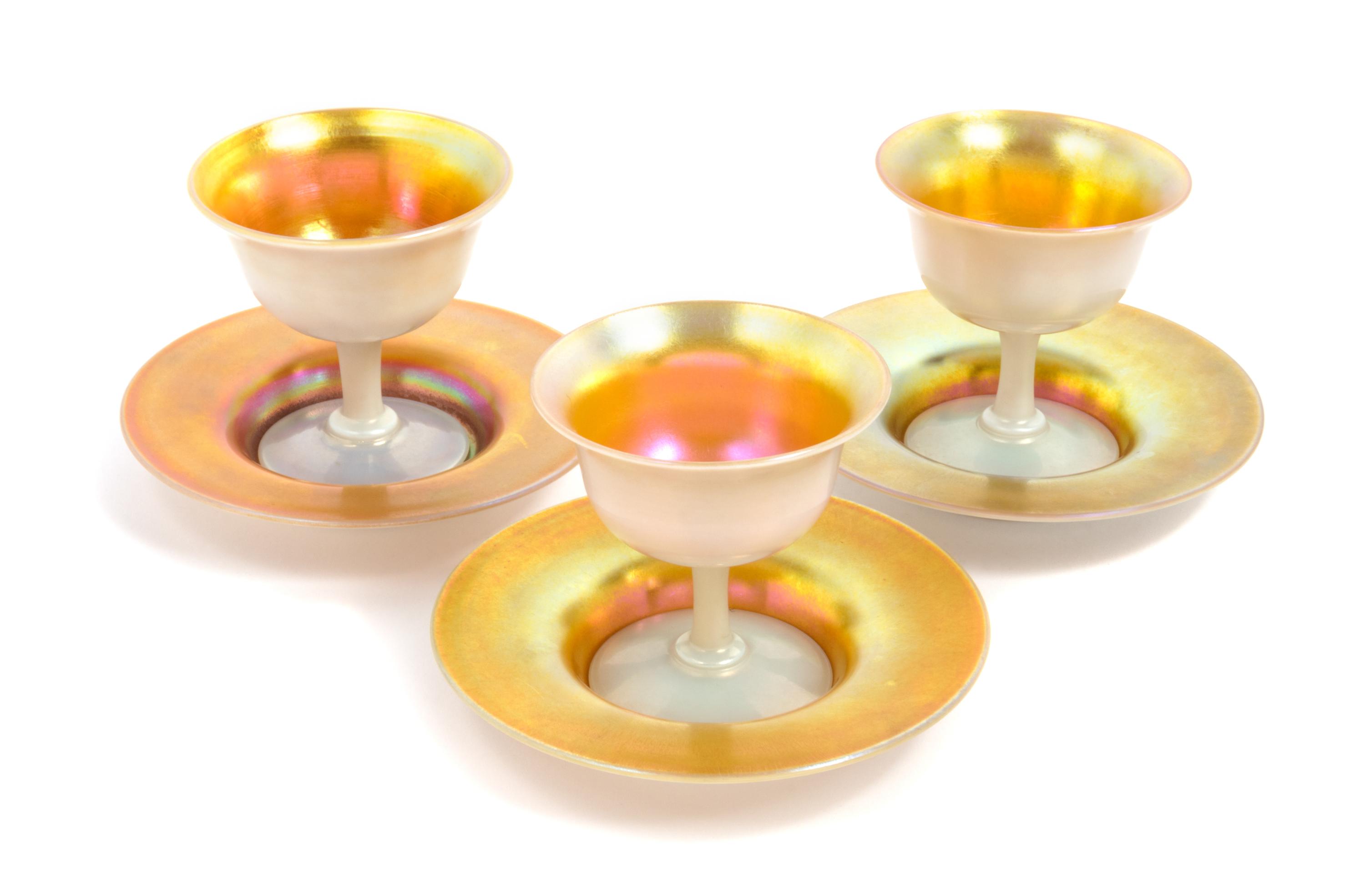 Steuben, EARLY 20TH CENTURY, a set of eight Aurene sherberts and under plates, in gold iridescence