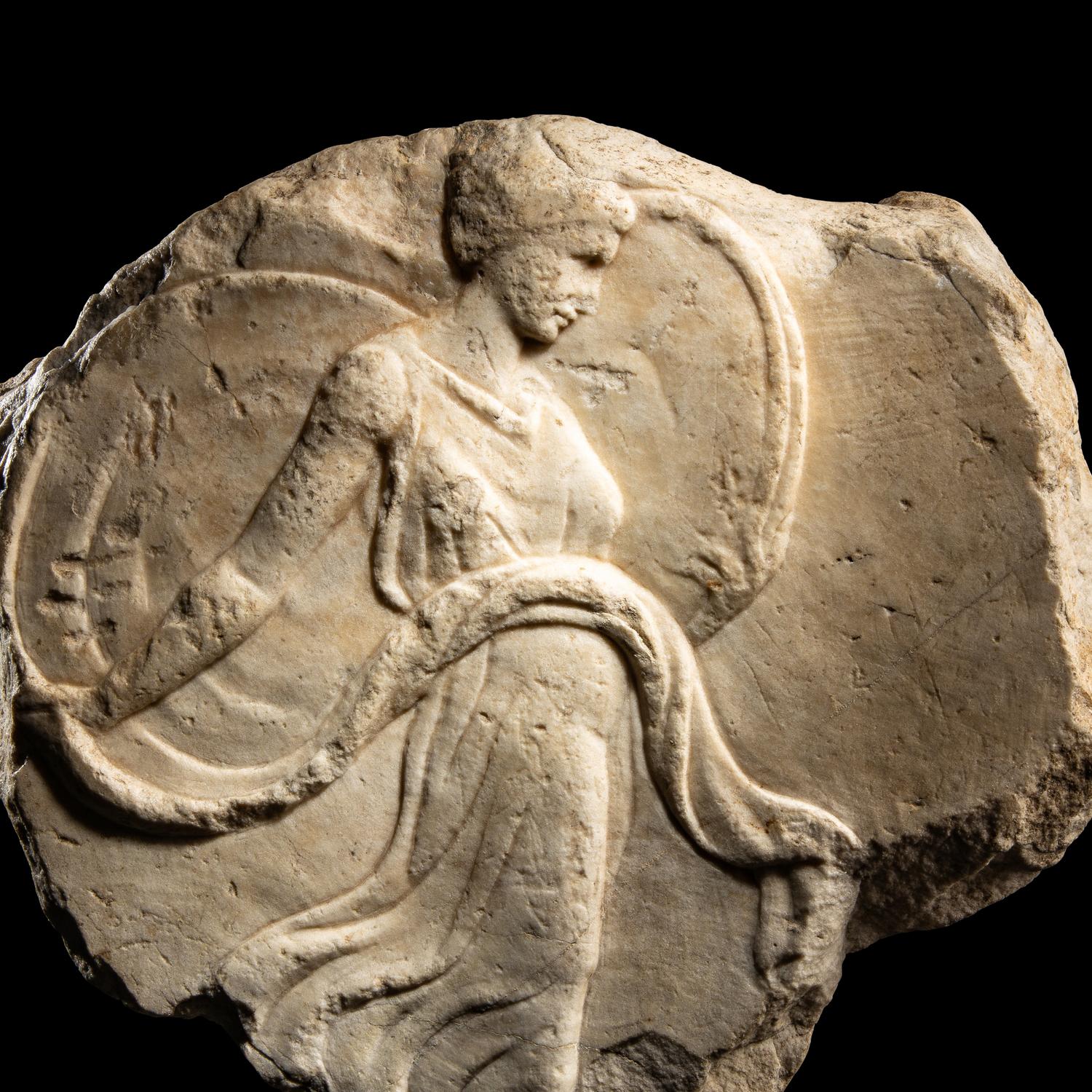 A Roman Marble Oscillum with a Dancing Maenad