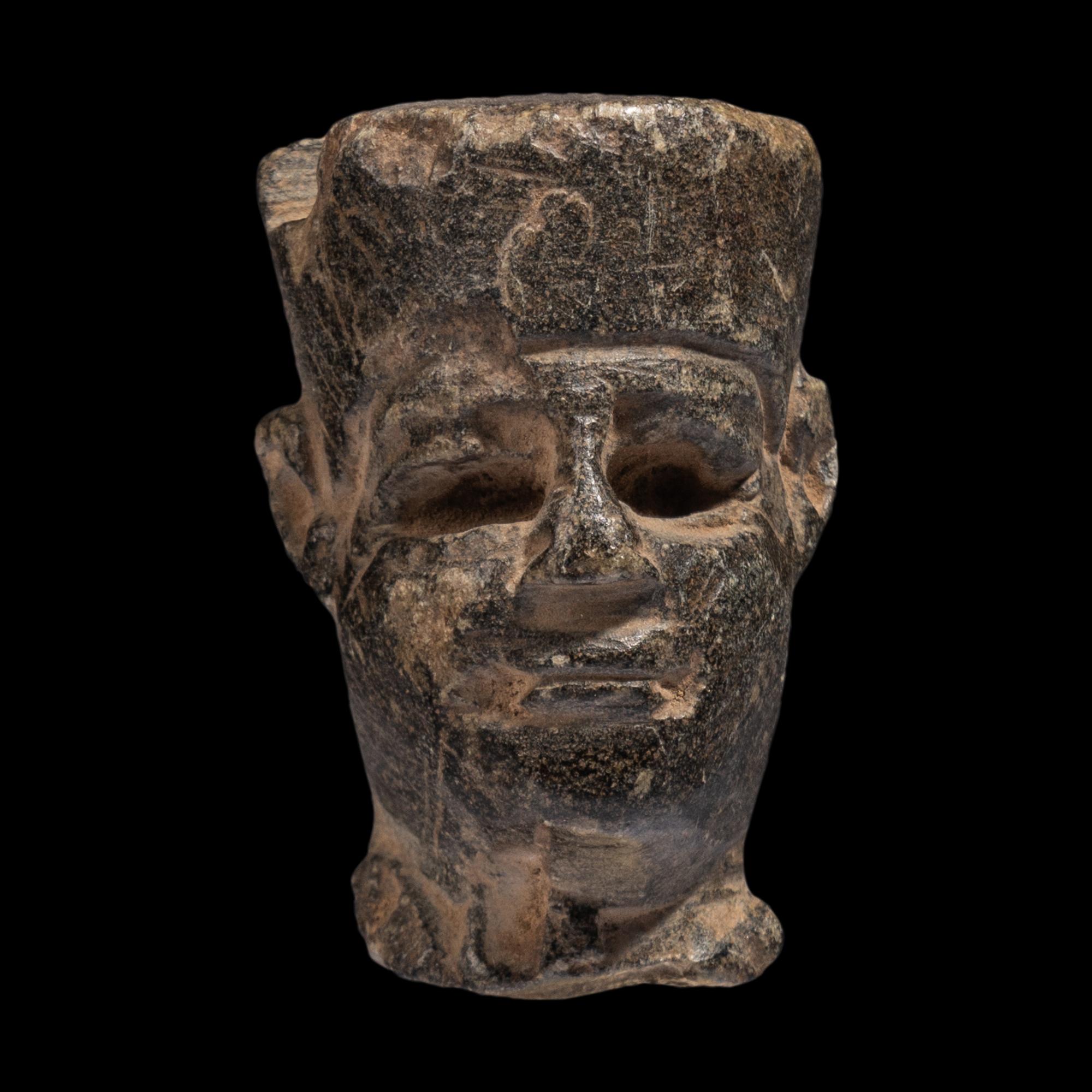 An Egyptian Stone Head of Amun