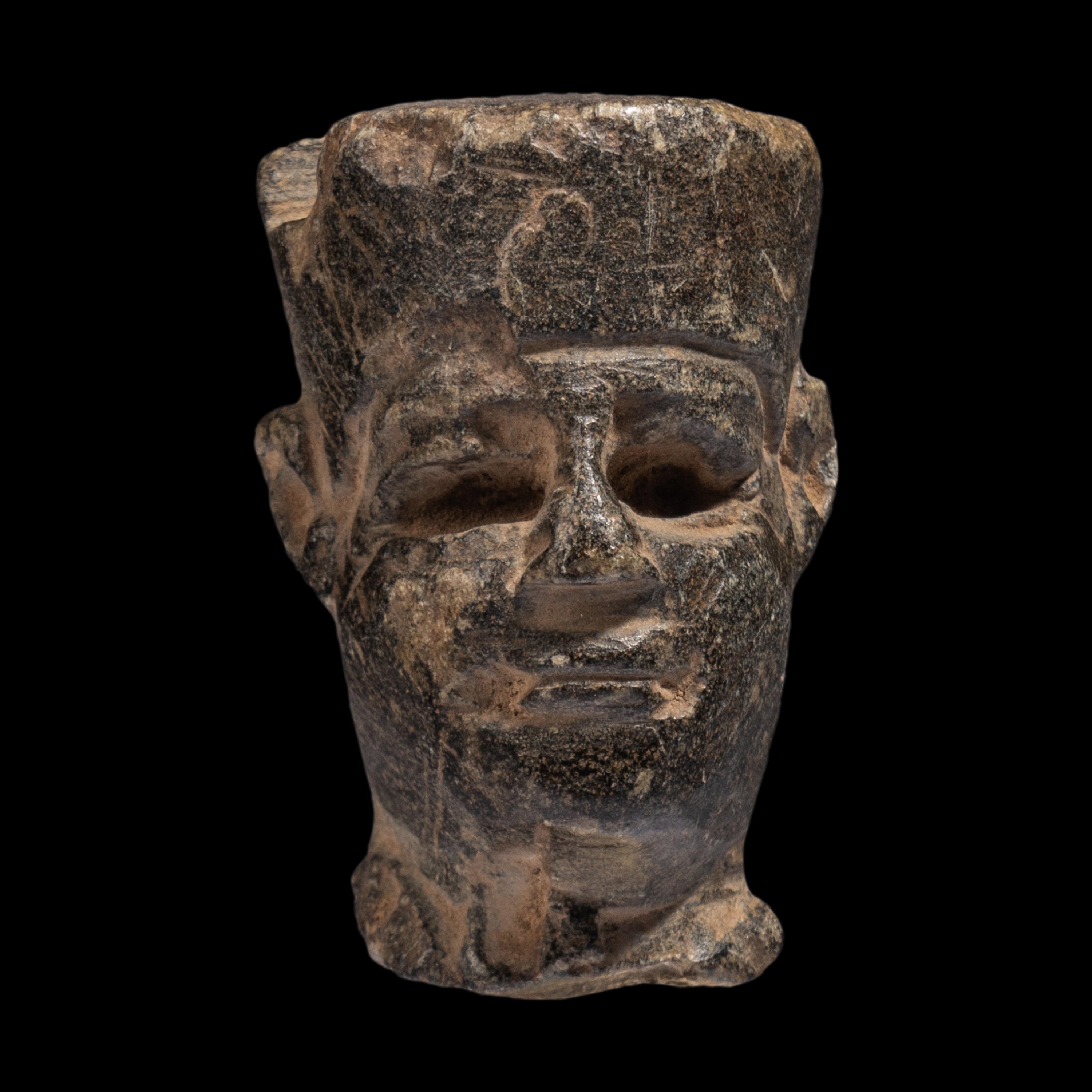 An Egyptian Stone Head of Amun