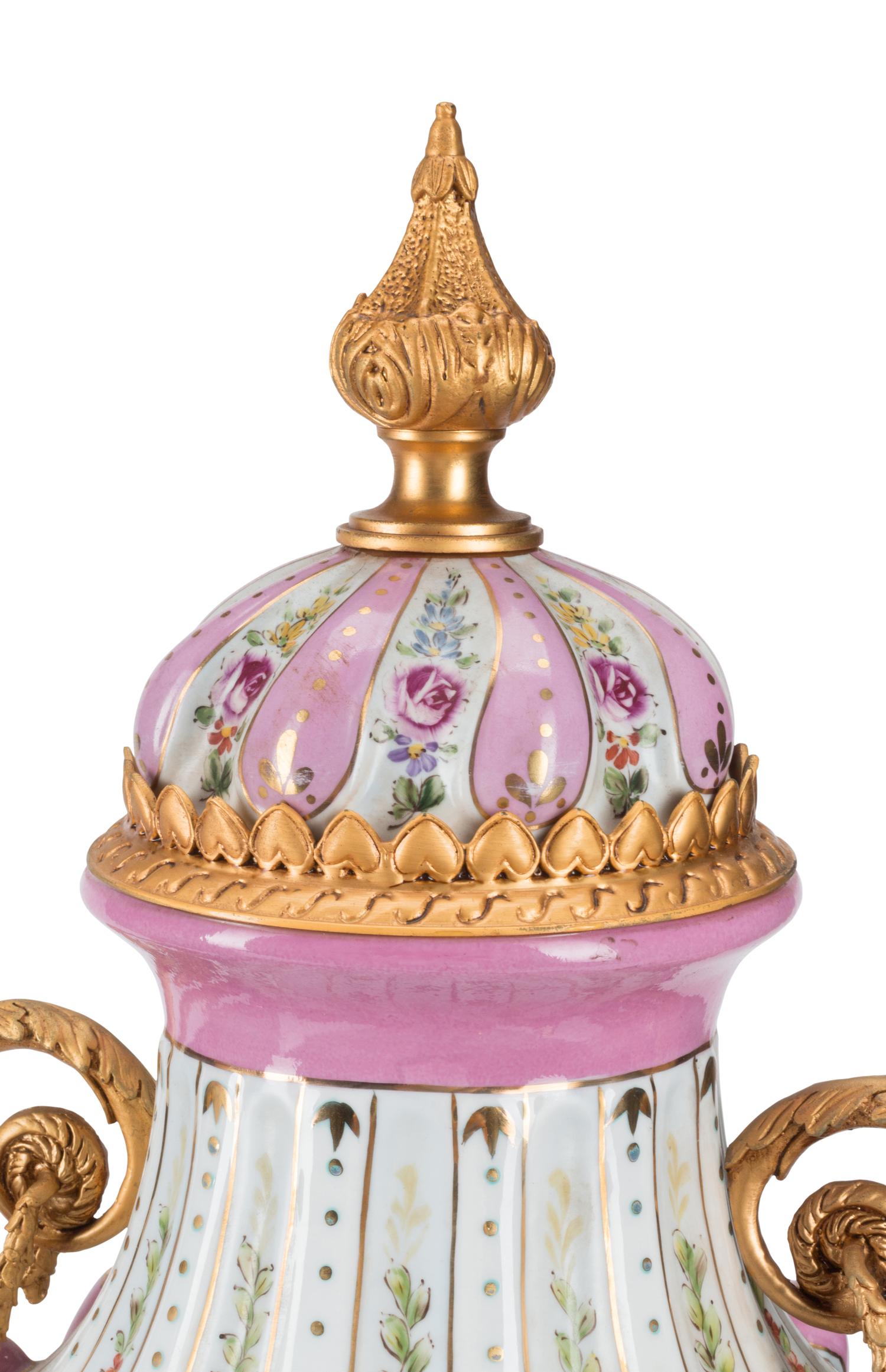 A Pair of Gilt Bronze Mounted Sèvres Style Porcelain Urns