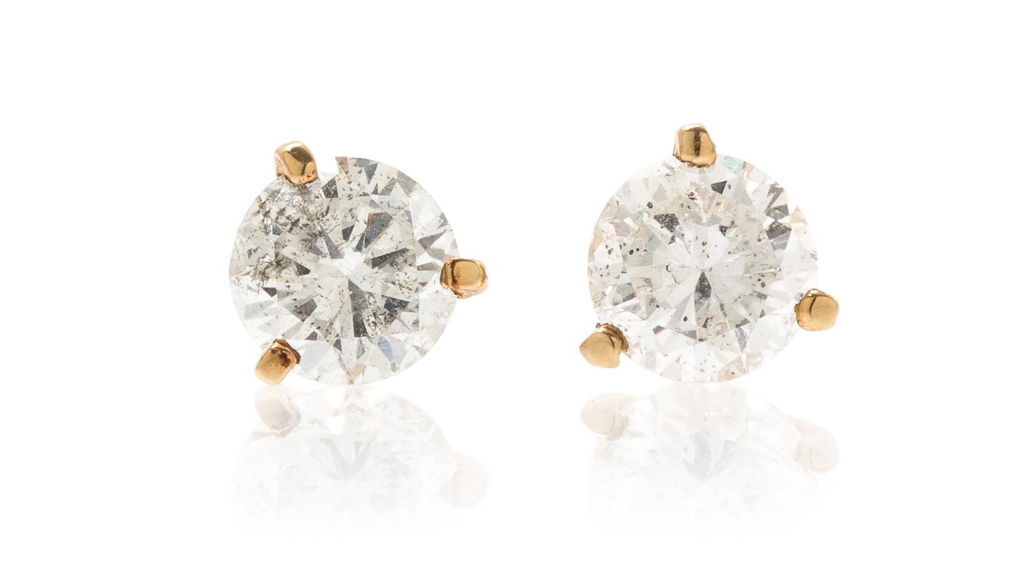 A Pair of 14 Karat Yellow Gold and Diamond Stud Earrings, 1.10 dwts.