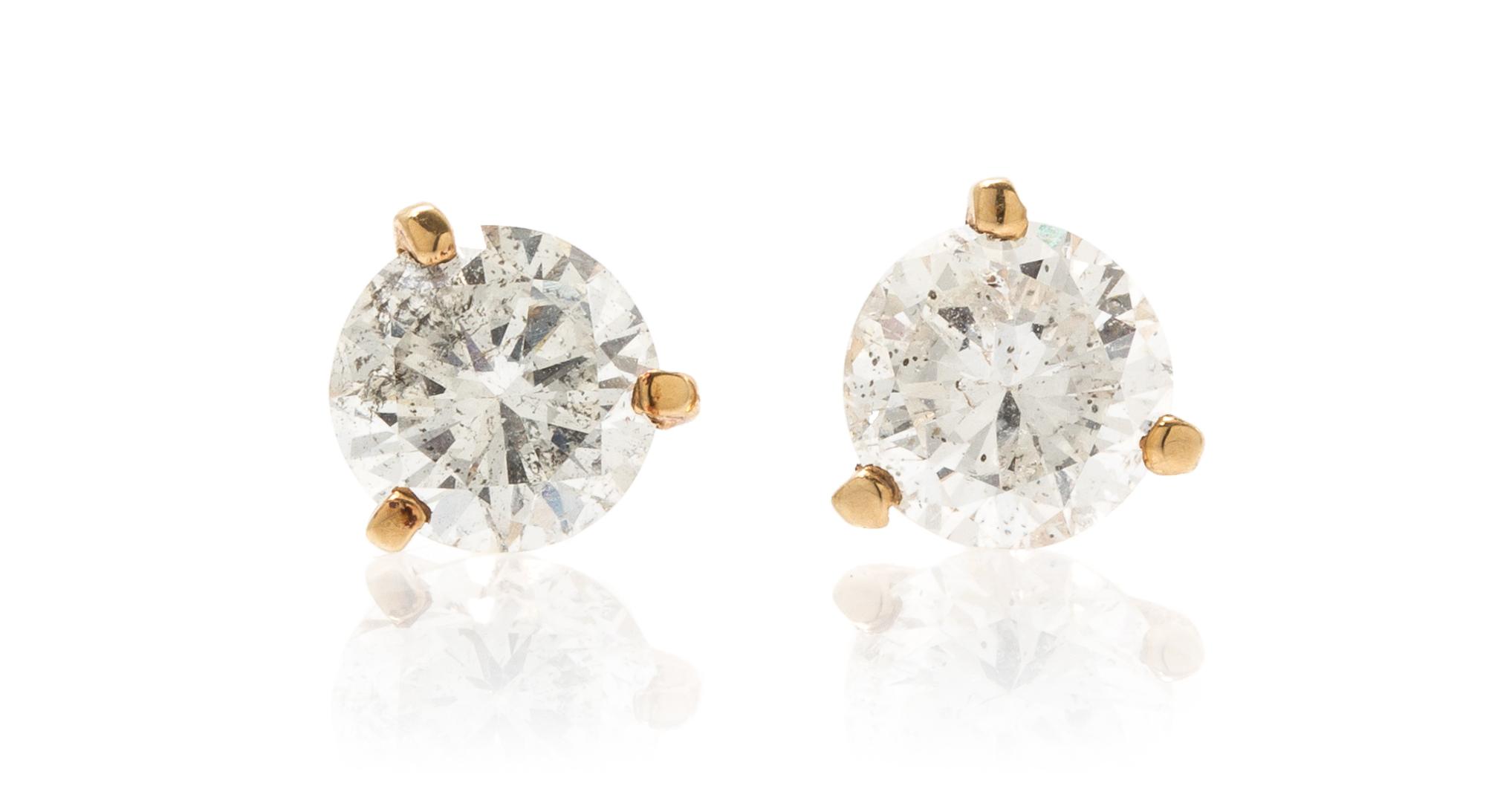 A Pair of 14 Karat Yellow Gold and Diamond Stud Earrings, 1.10 dwts.