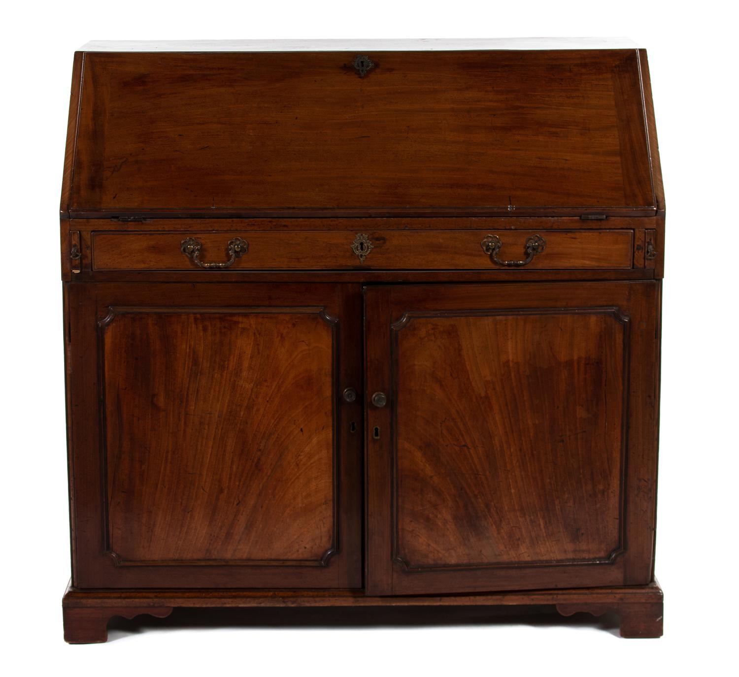 A George III Mahogany Slant-Front Desk — THIRD QUARTER 18TH CENTURY