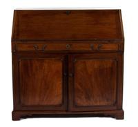 A George III Mahogany Slant-Front Desk — THIRD QUARTER 18TH CENTURY