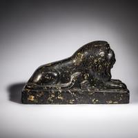 An Egyptian Black Marble Recumbent Lion