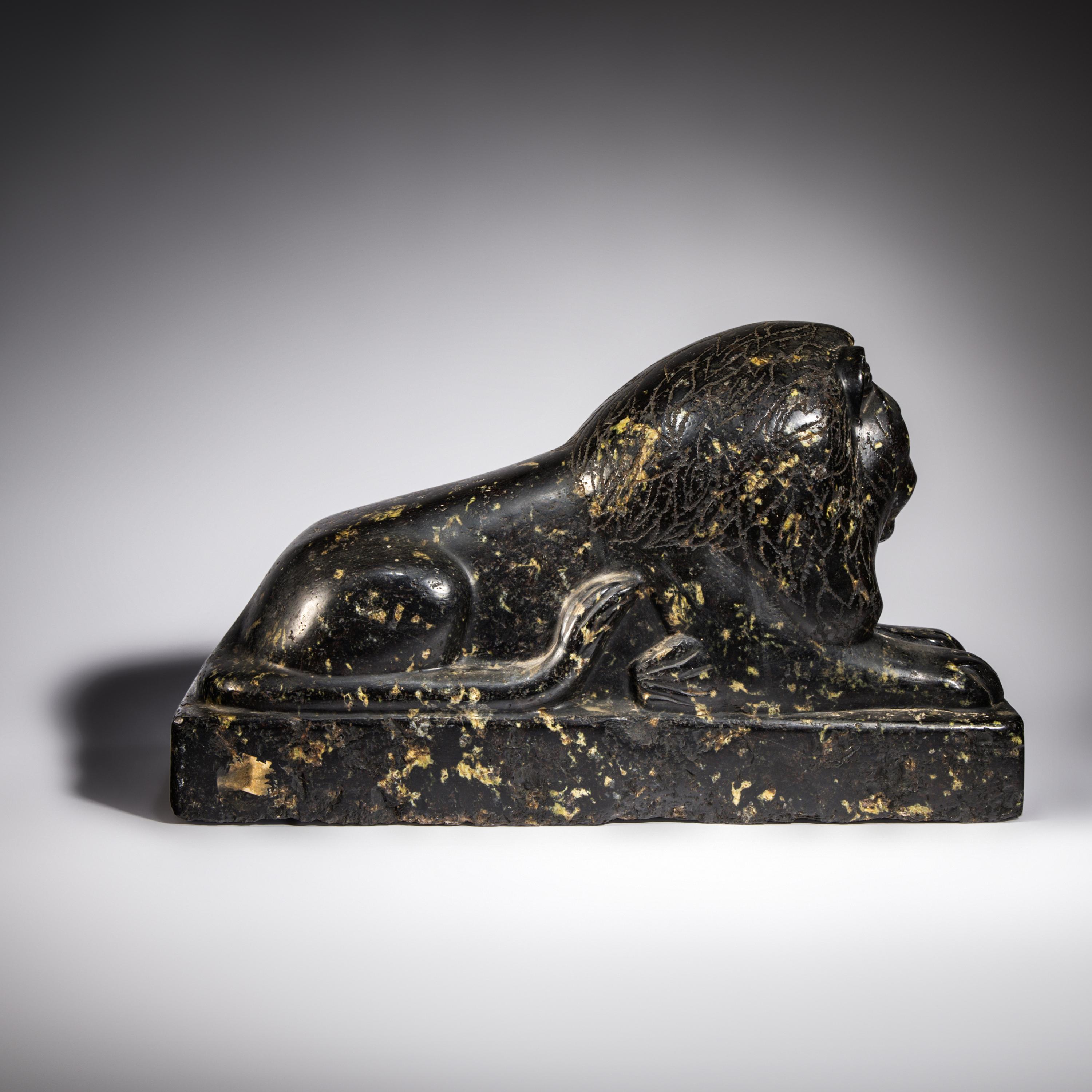 An Egyptian Black Marble Recumbent Lion