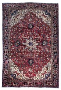 A Heriz Wool Rug 11 feet 8 inches x 7 feet 11 inches.