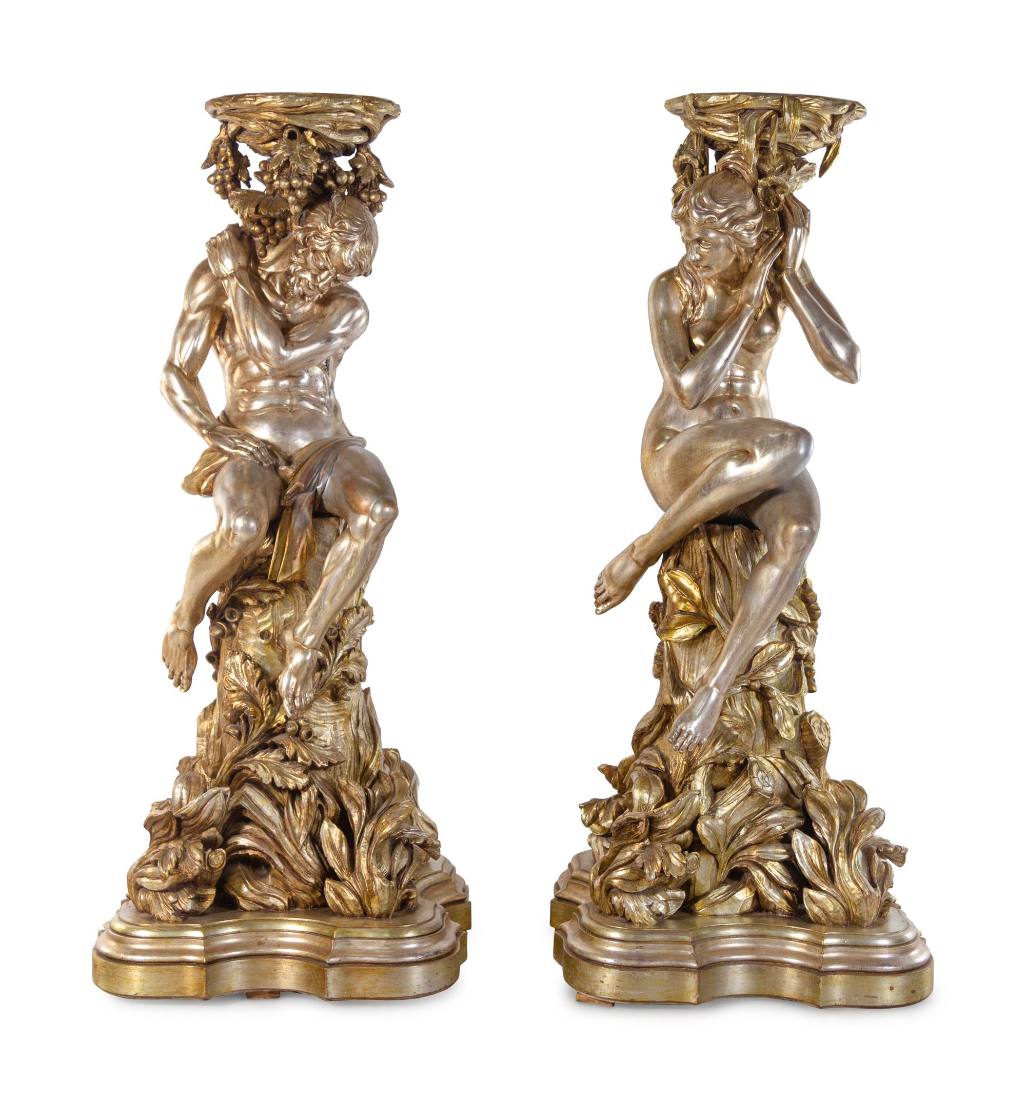 A Pair of Monumental Italian Baroque Style Gilt and Silvered Composition Figural Pedestals