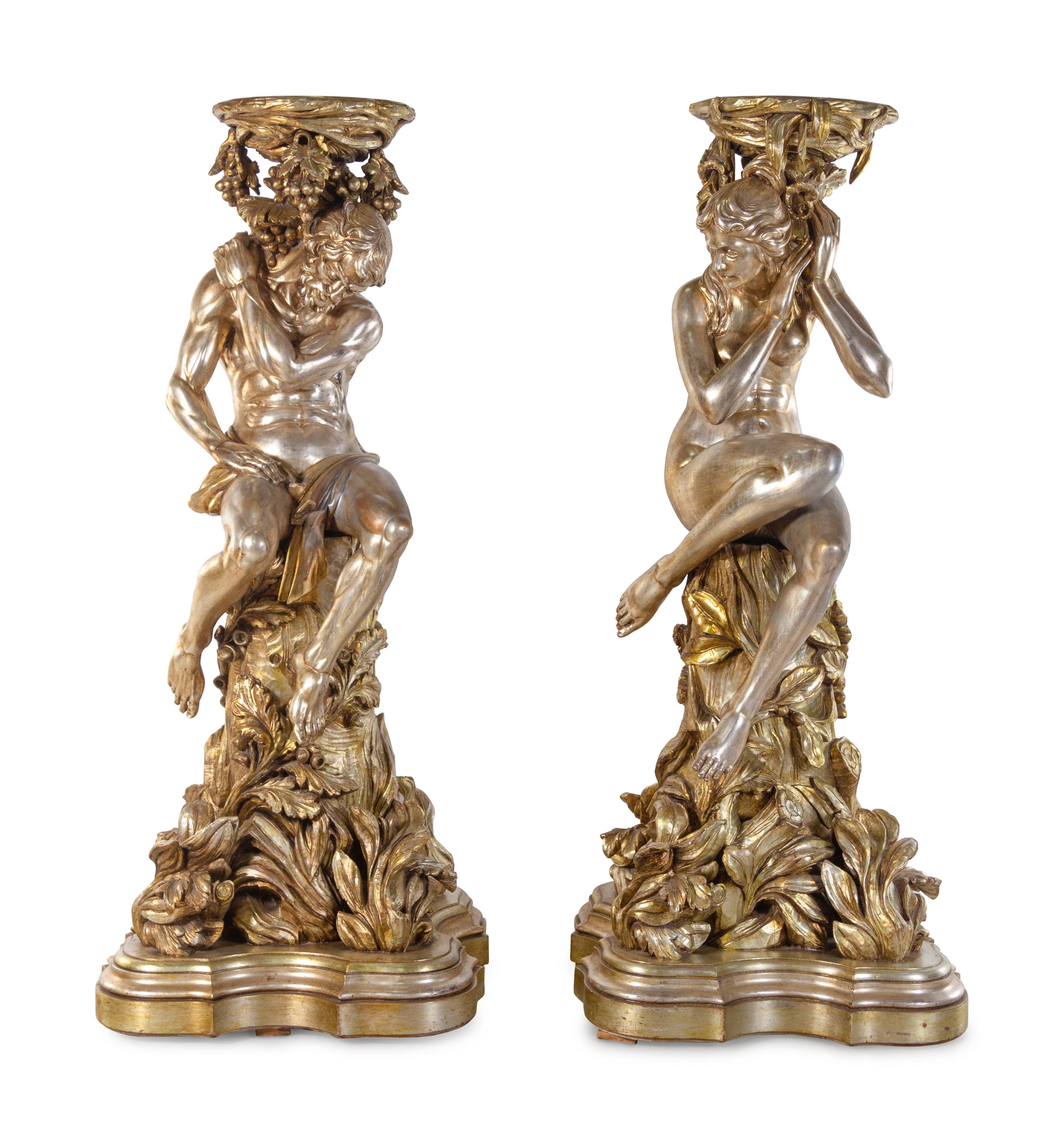 A Pair of Monumental Italian Baroque Style Gilt and Silvered Composition Figural Pedestals