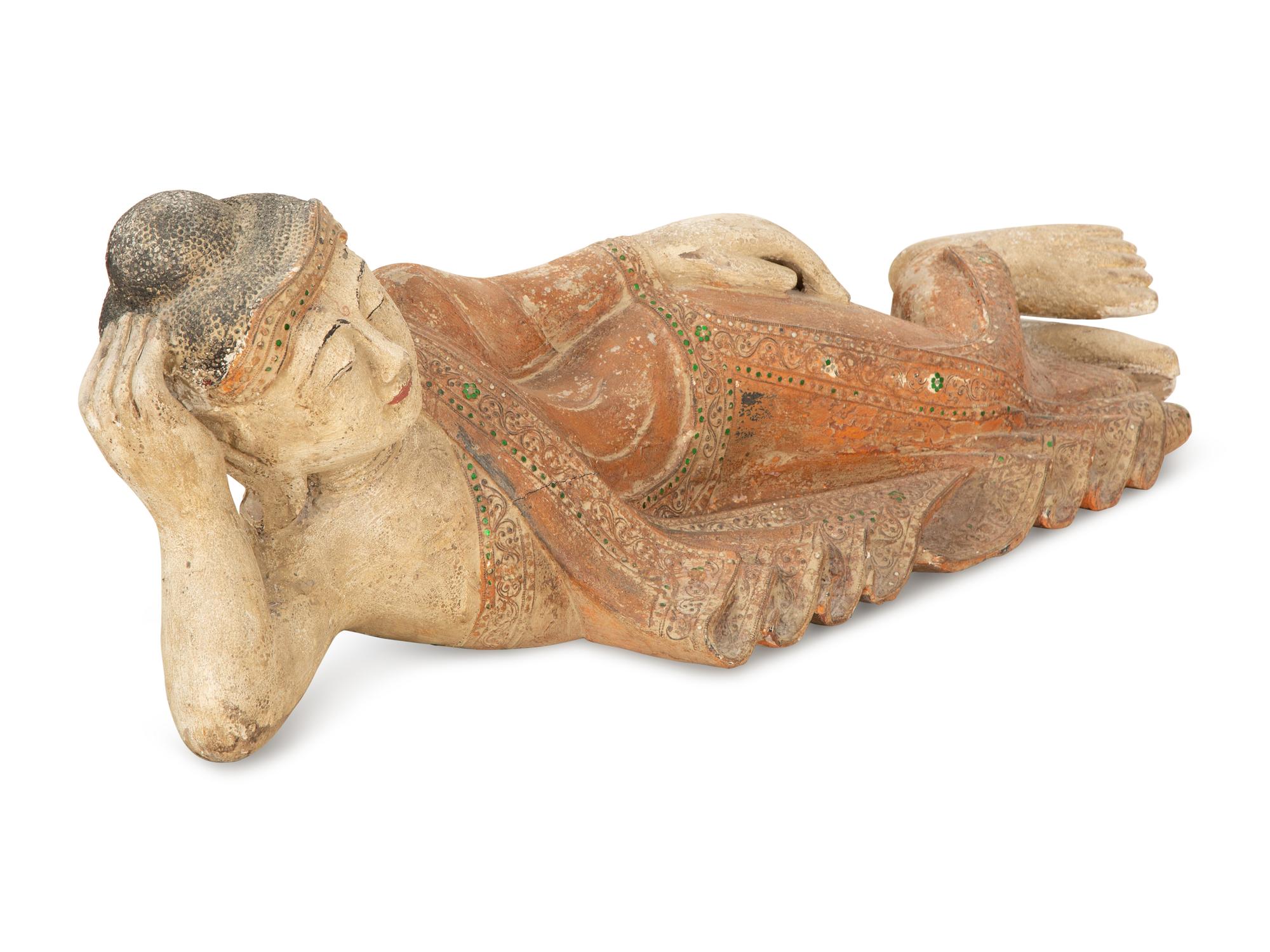 A South-East Asian Carved and Painted Wood Sculpture of a Reclining Buddha — 19th/20th Century