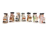 A Collection of Seven Ceramic Toby Mugs
