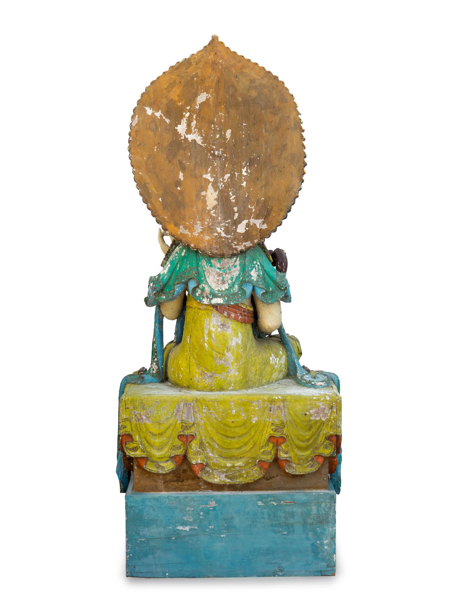 A Large Polychromed Wood Figure of Seated Guanyin