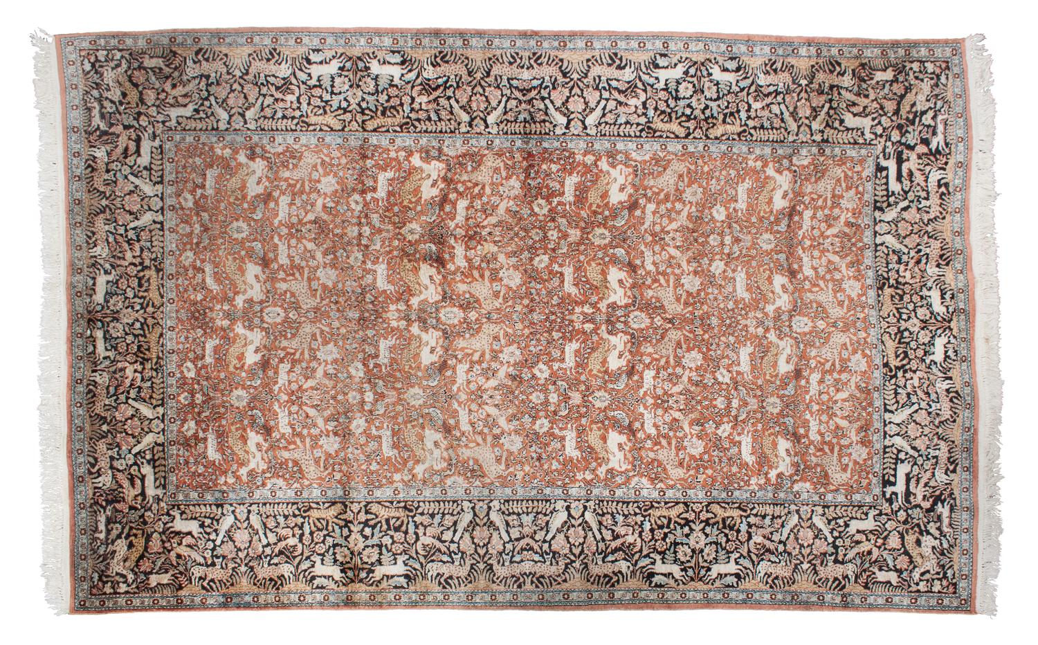 A Persian Silk and Wool Rug 9 feet 9 inches x 6 feet 8 1/2 inches.