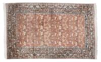 A Persian Silk and Wool Rug 9 feet 9 inches x 6 feet 8 1/2 inches.
