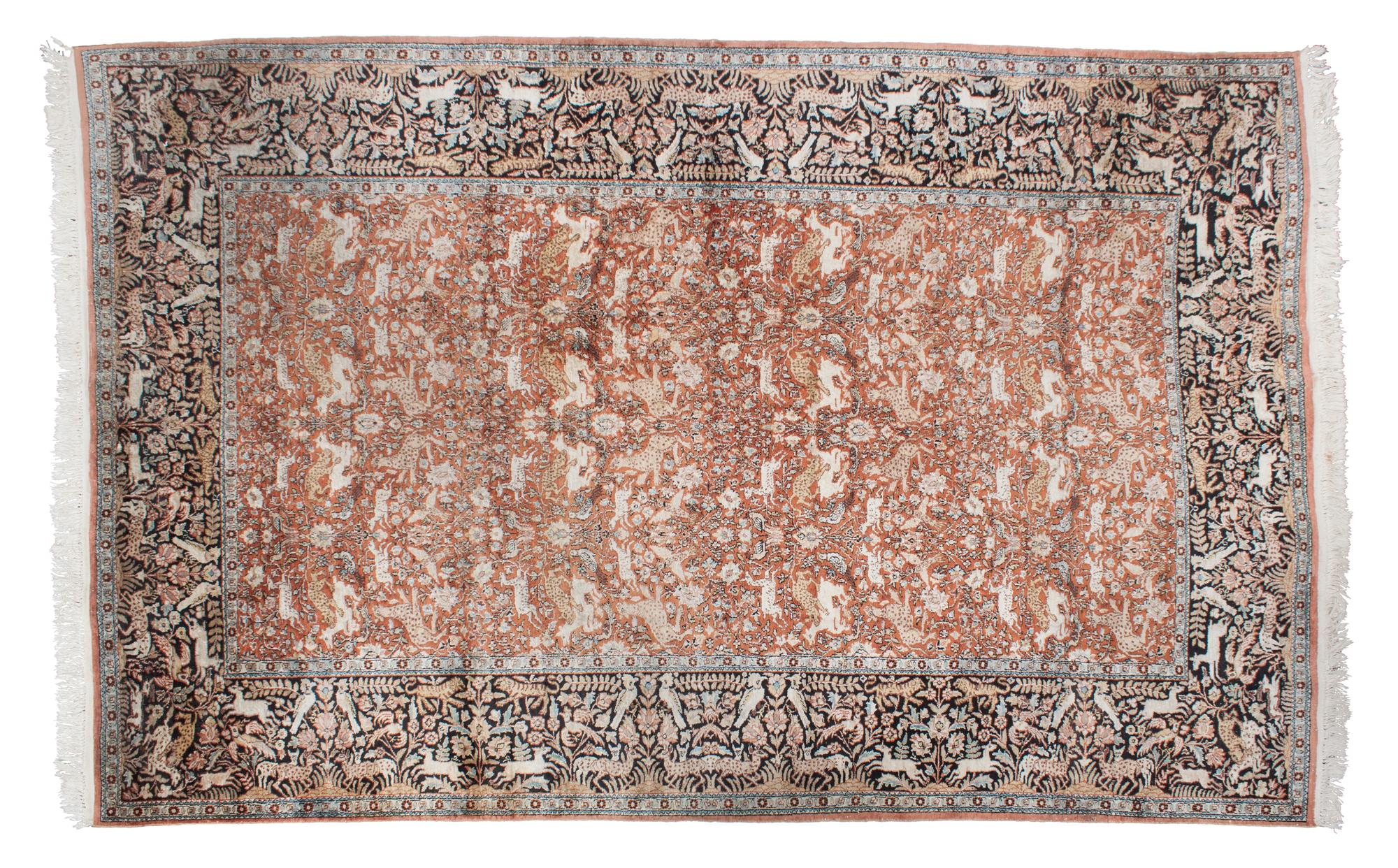 A Persian Silk and Wool Rug 9 feet 9 inches x 6 feet 8 1/2 inches.