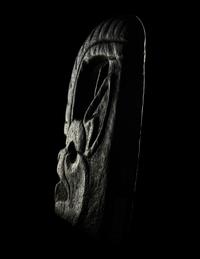 A Maya Stone Hacha in the Form of a Jaguar or Bat