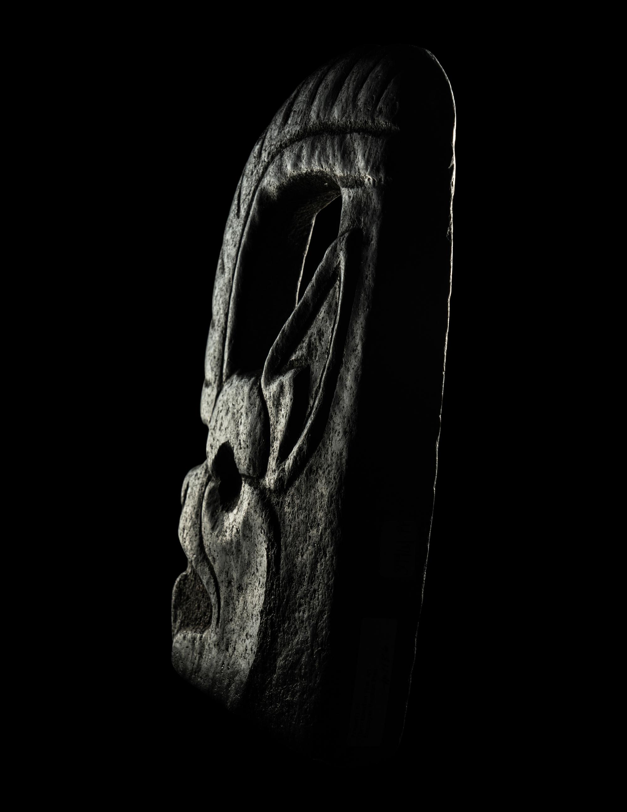 A Maya Stone Hacha in the Form of a Jaguar or Bat