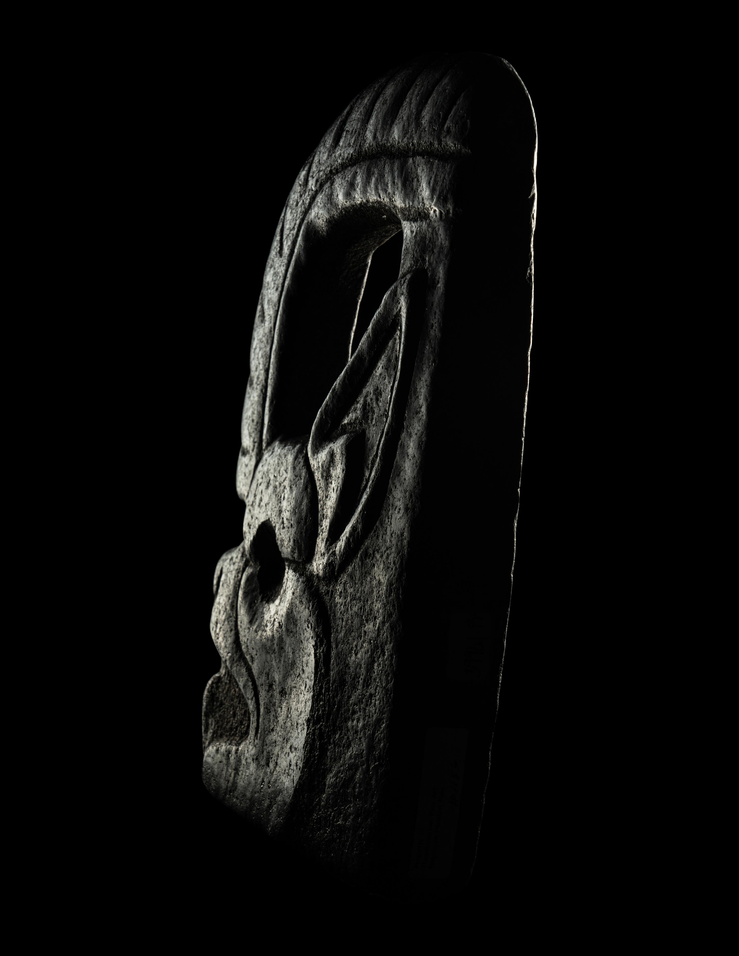 A Maya Stone Hacha in the Form of a Jaguar or Bat