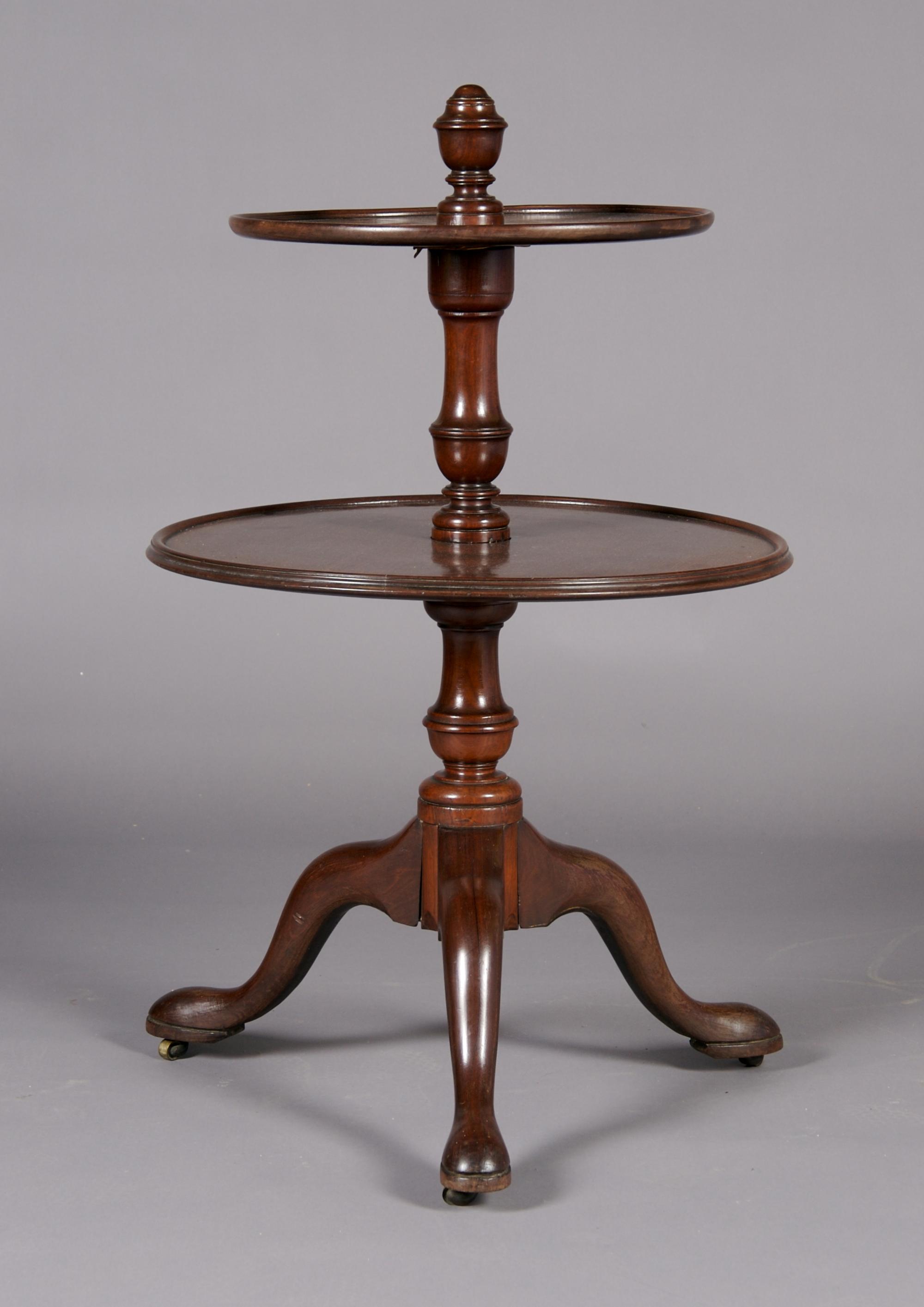 An English Mahogany Two-Tiered Dumb Waiter, Height 38 inches.