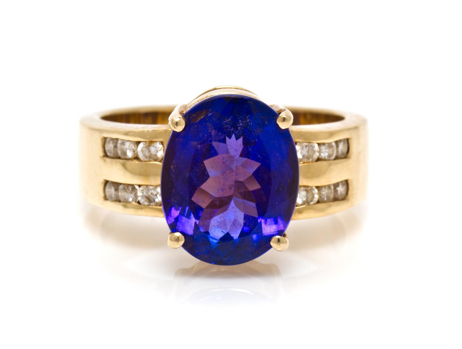 A 14 Karat Yellow Gold, Tanzanite and Diamond Ring, 7.30 dwts.