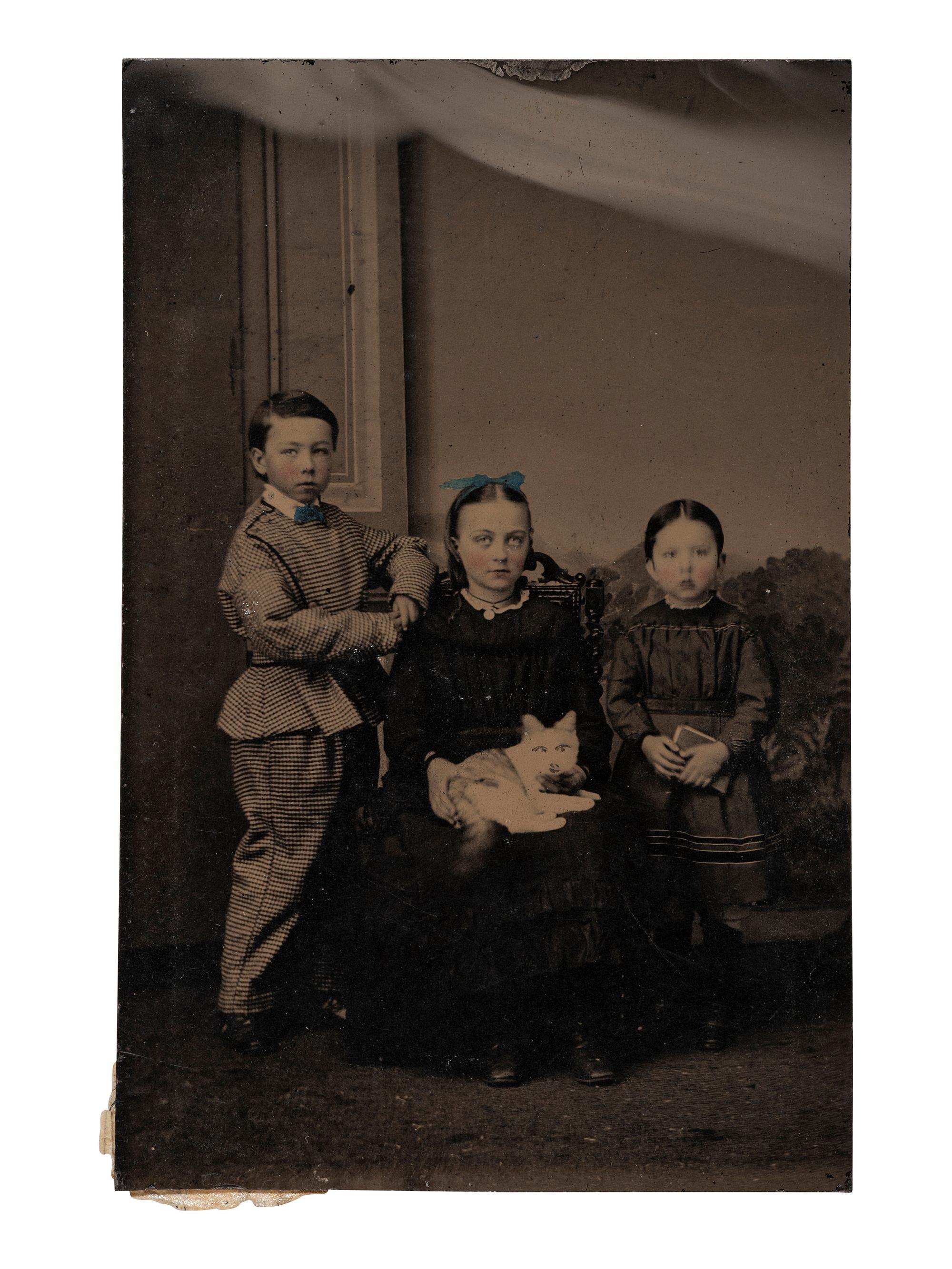 [EARLY PHOTOGRAPHY]. Tintypes of people with cats, incl. a charming portrait of 3 children and their feline friend by Hennigar of Lambertville, NJ.