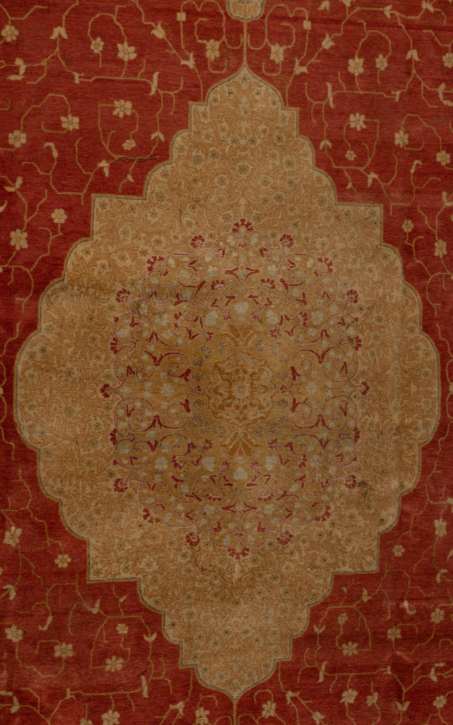 An Indo-Tabriz Wool Rug