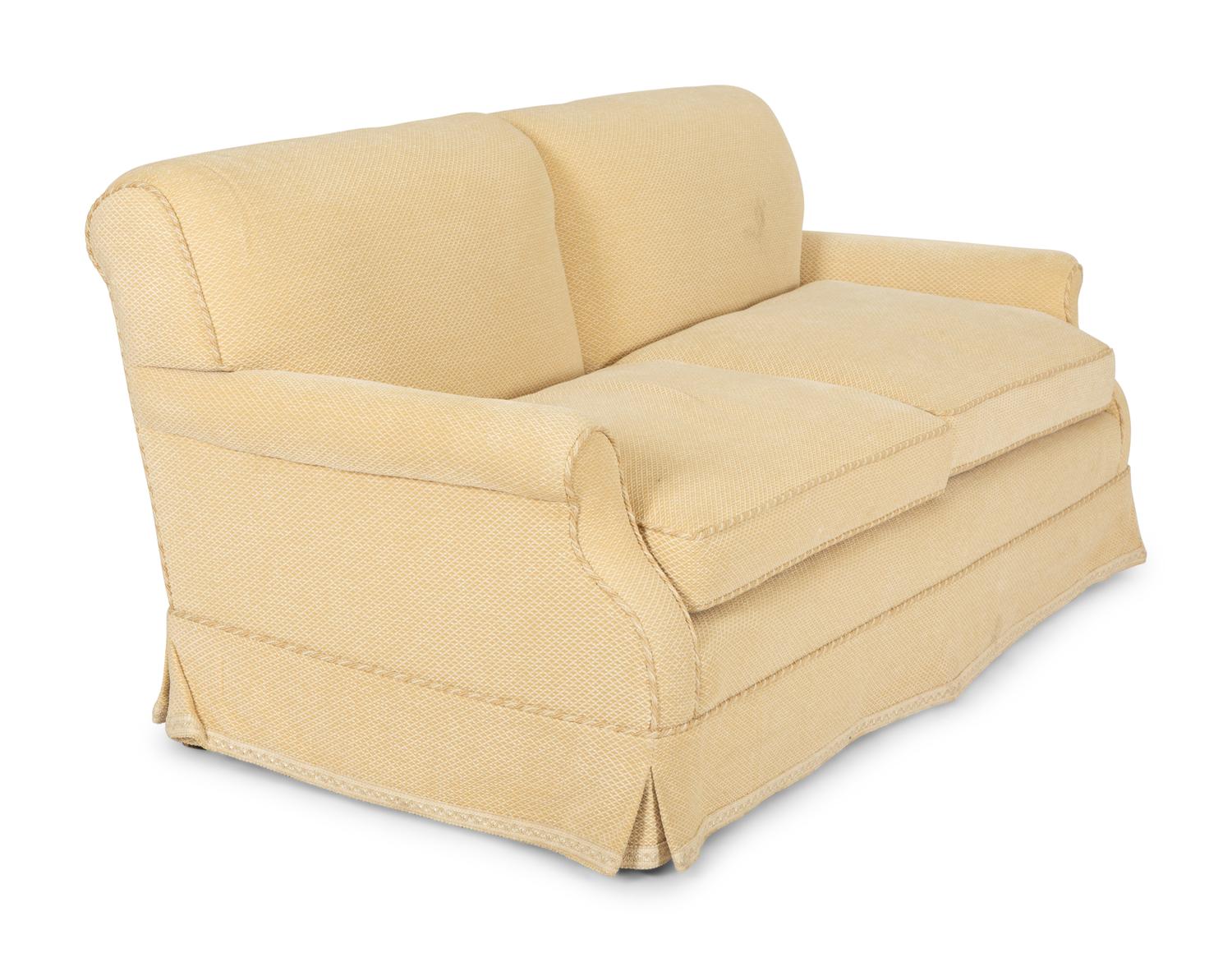 A Pair of Ivory Upholstered Three Cushion Sofas — 20th Century
