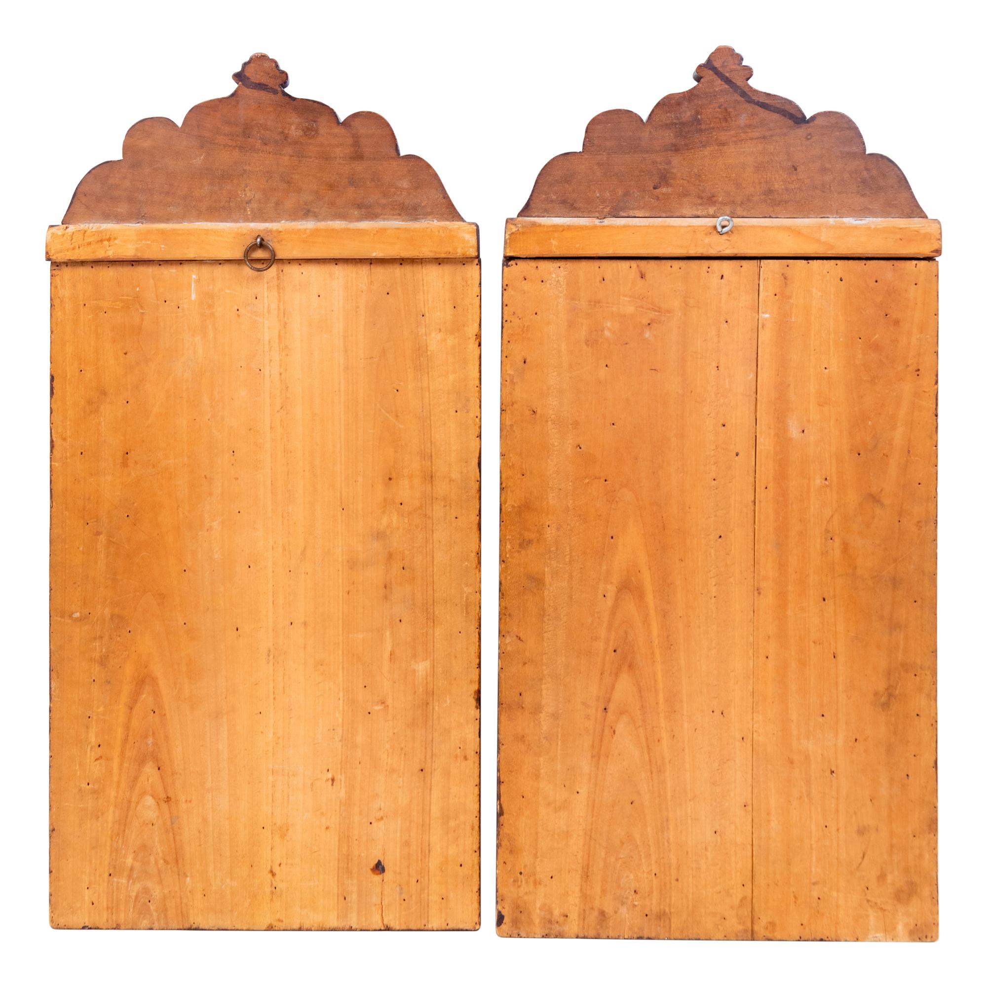 A Pair of Persian Carved Walnut Mirrors