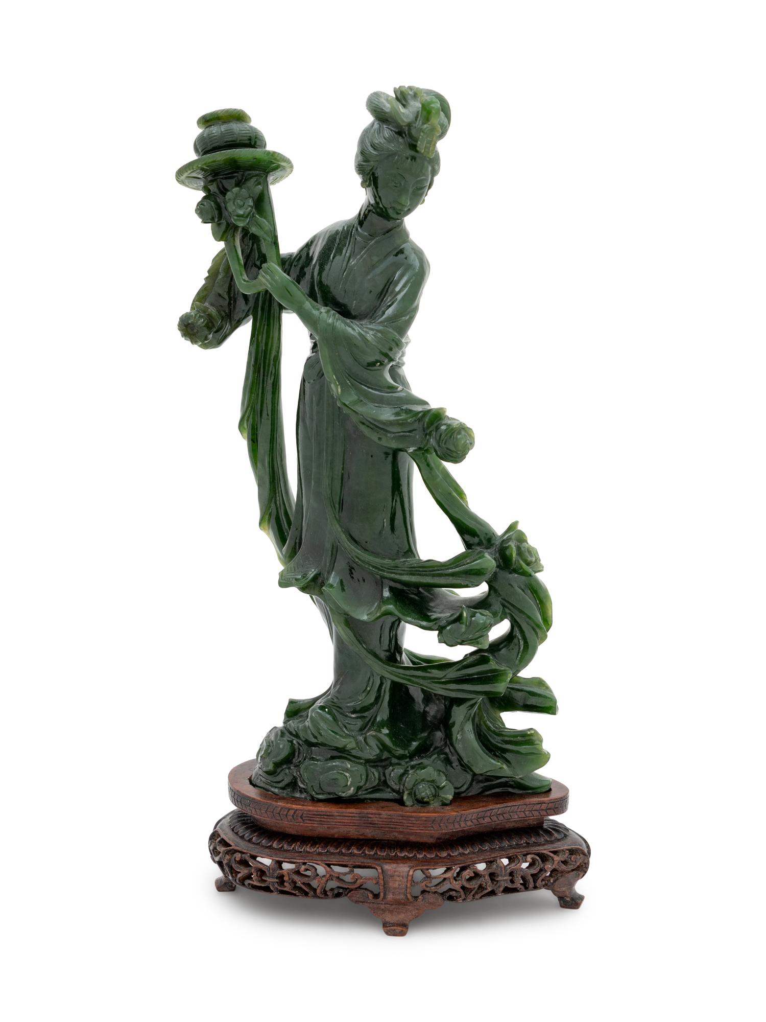 A Large Chinese Spinach Jade Figure of a Female Immortal