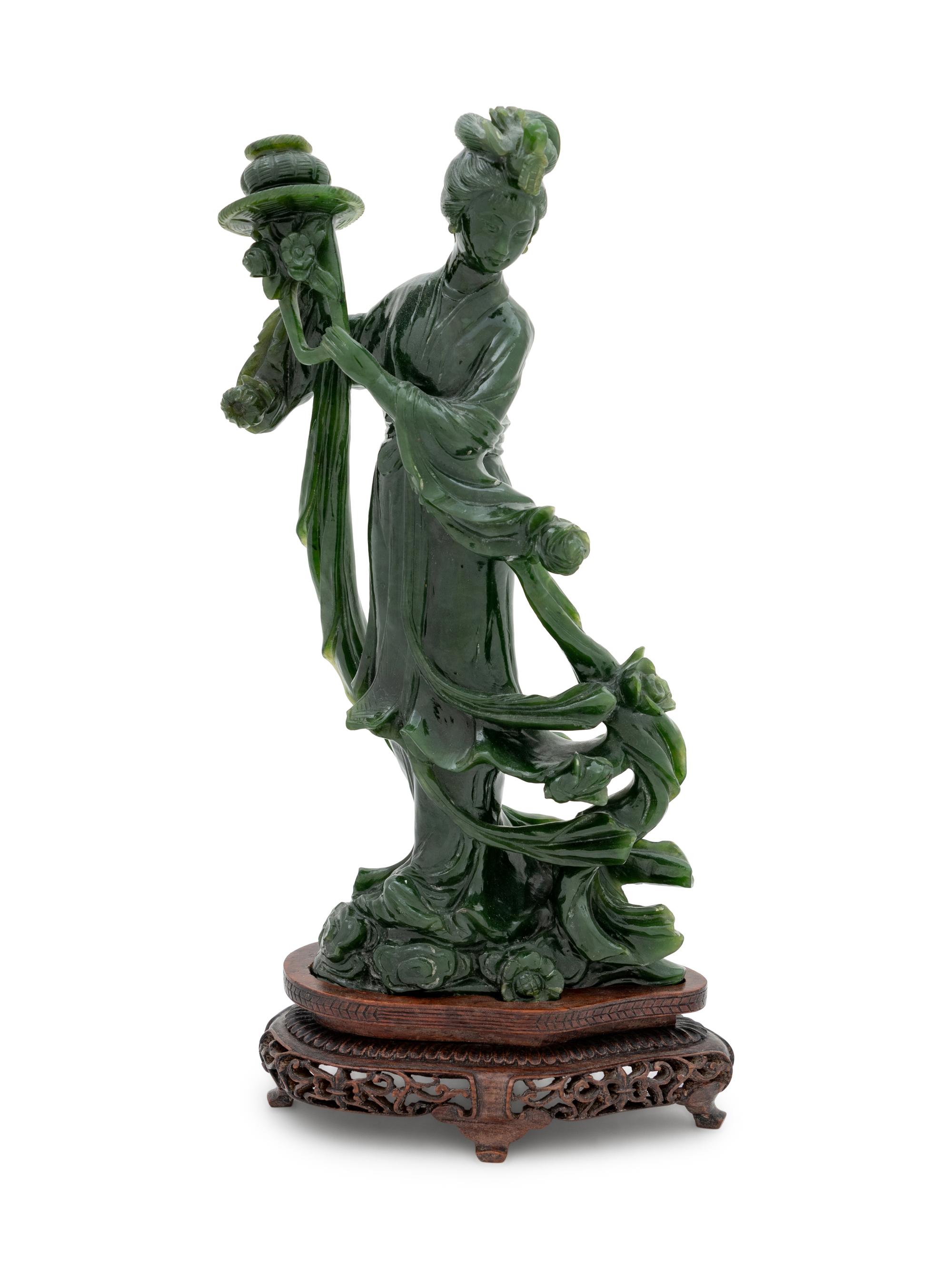 A Large Chinese Spinach Jade Figure of a Female Immortal