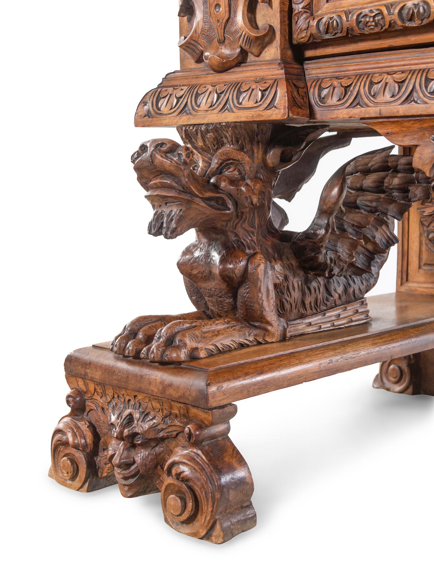 An Italian Renaissance Revival Carved Walnut Cassone on Stand