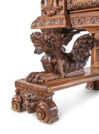 An Italian Renaissance Revival Carved Walnut Cassone on Stand