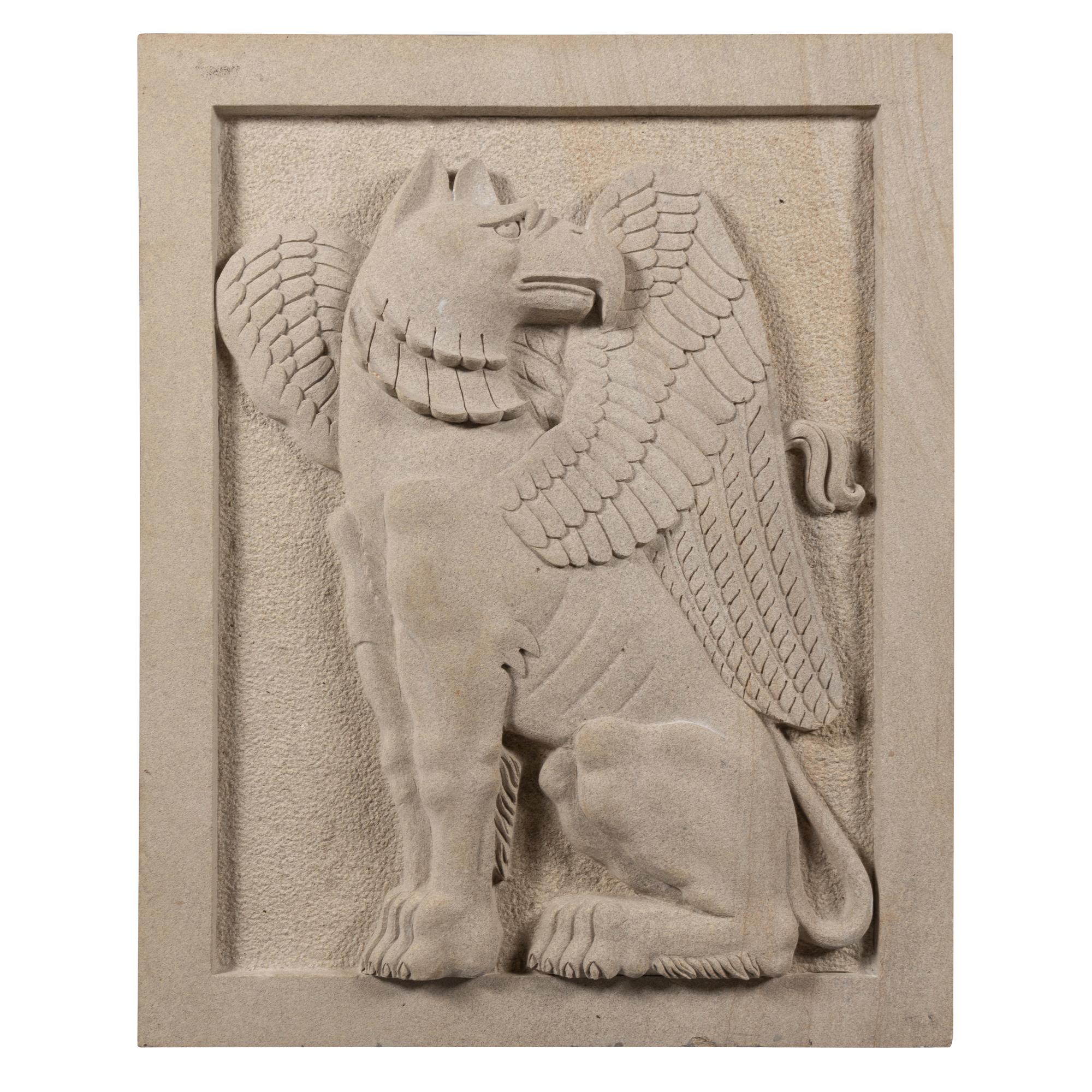 A Pair of Large Carved Granite Reliefs of Griffins