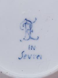 Three Sèvres Painted, Parcel Gilt and "Jeweled" Celeste Blue-Ground Porcelain Teacups and Saucers