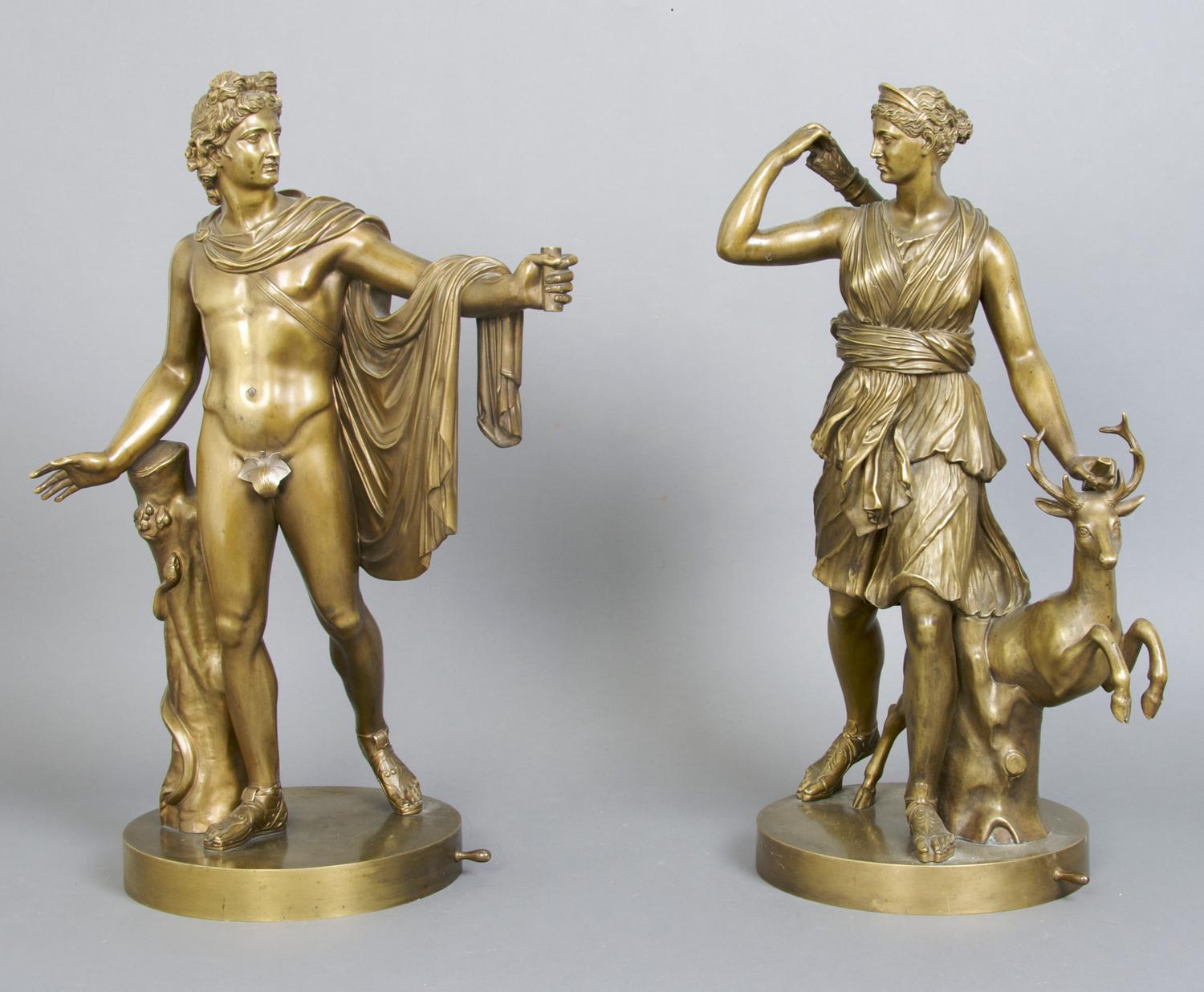 A Pair of Bronze Figures, Height overall 18 1/2 inches.