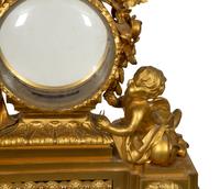 A Louis XVI Gilt Bronze Mounted Marble Mantel Clock