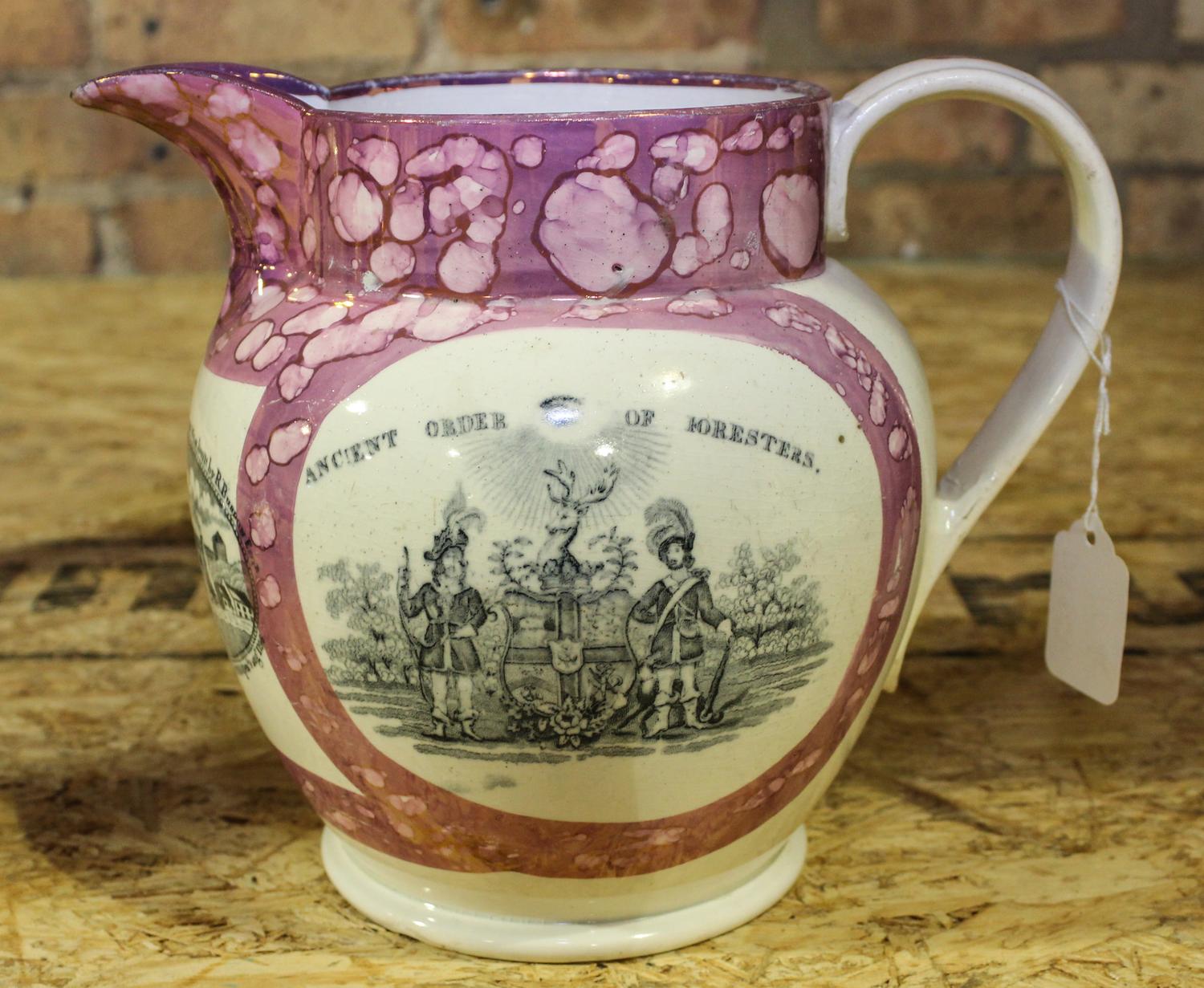 A Sunderland Pink Lusterware Pitcher Height of 7 1/2 inches.
