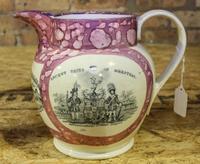 A Sunderland Pink Lusterware Pitcher Height of 7 1/2 inches.
