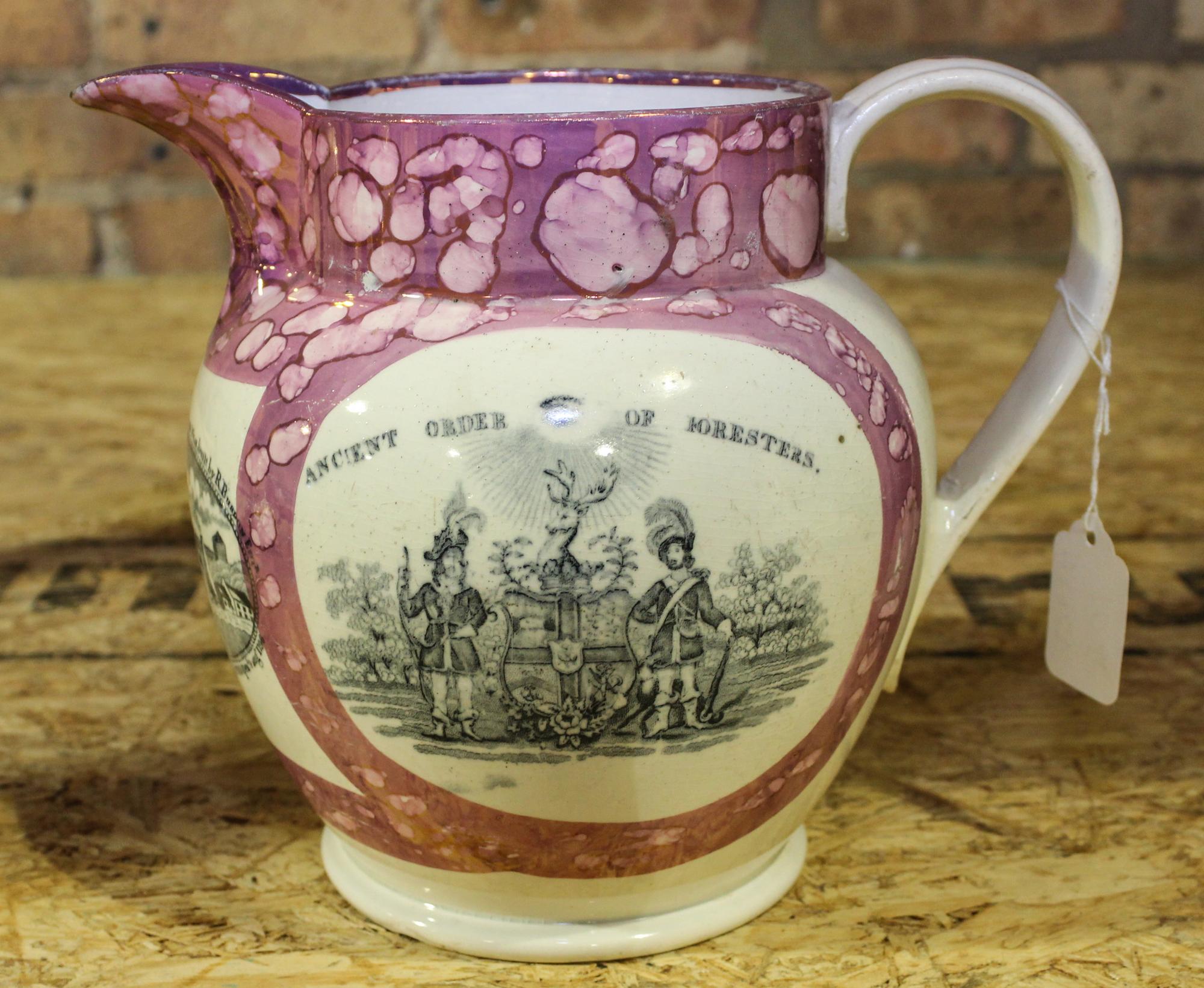 A Sunderland Pink Lusterware Pitcher Height of 7 1/2 inches.