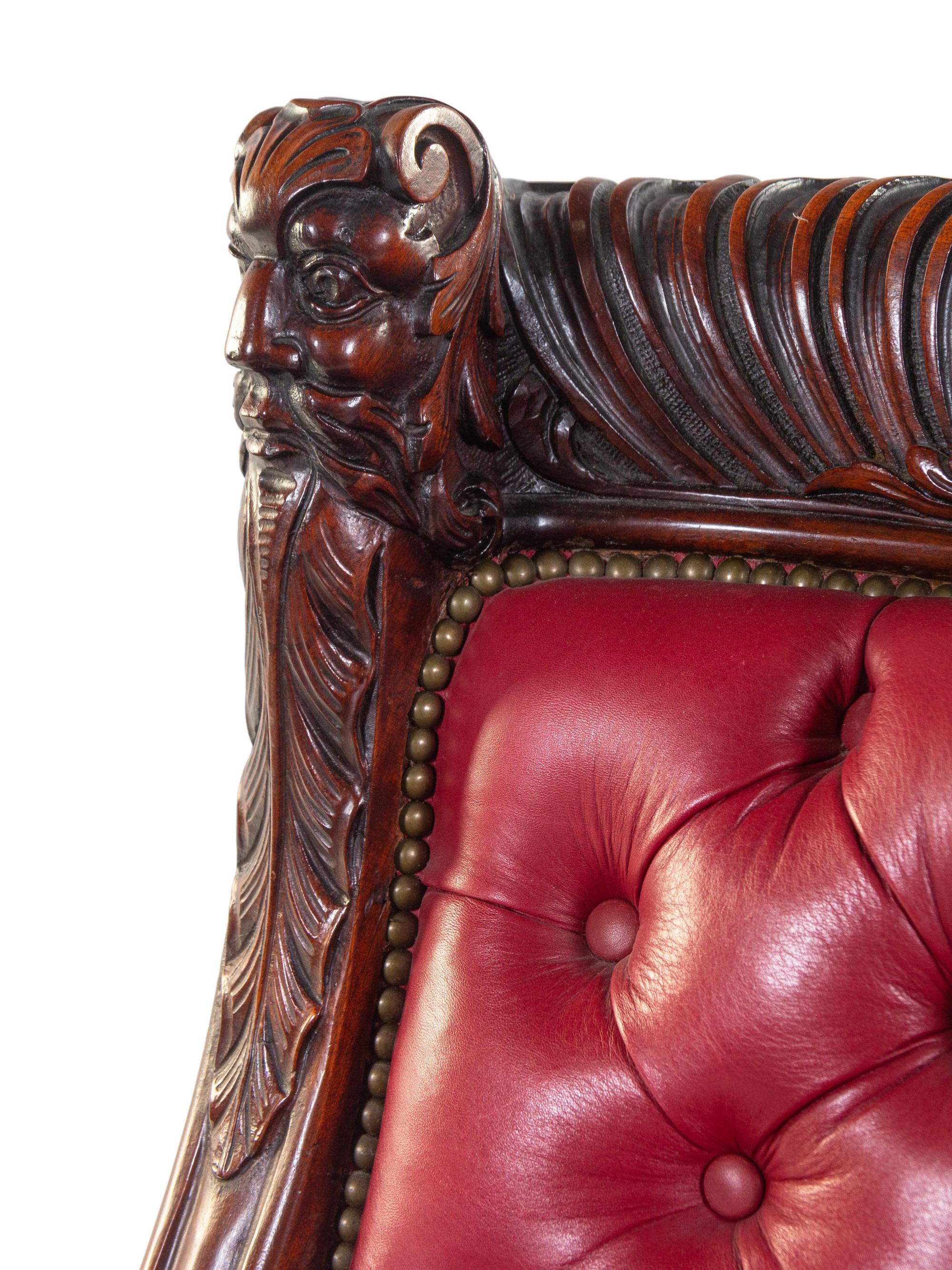 A Renaissance Revival Carved Mahogany Gentleman's and Lady's Chair Set