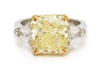 A Platinum, 22 Karat Yellow Gold, Fancy Yellow Diamond and Diamond Ring, 8.00 dwts.