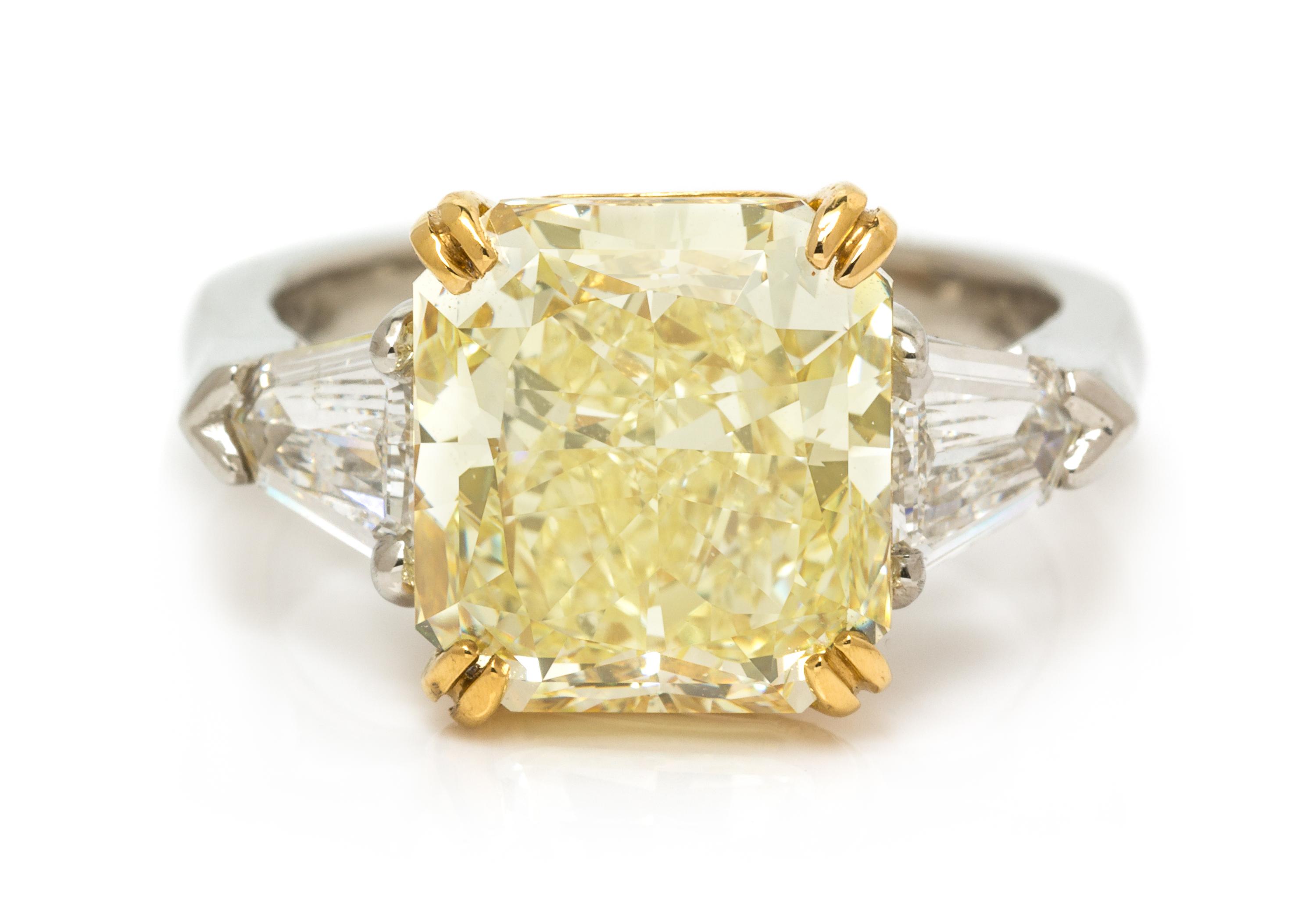 A Platinum, 22 Karat Yellow Gold, Fancy Yellow Diamond and Diamond Ring, 8.00 dwts.
