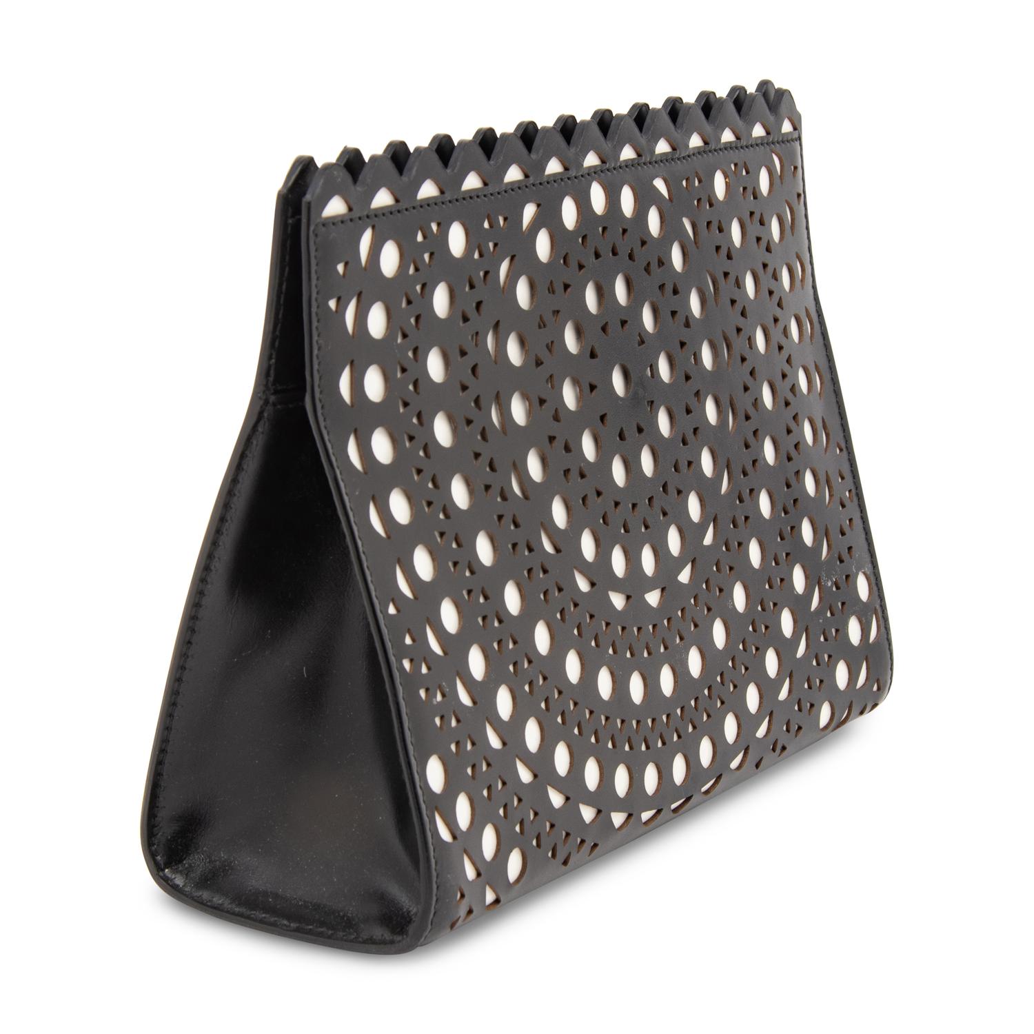 ALAÏA, LASER-CUT LEATHER CLUTCH