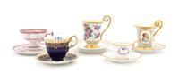 A Group of Porcelain Cups and Saucers Height of tallest 4 3/4 inches.