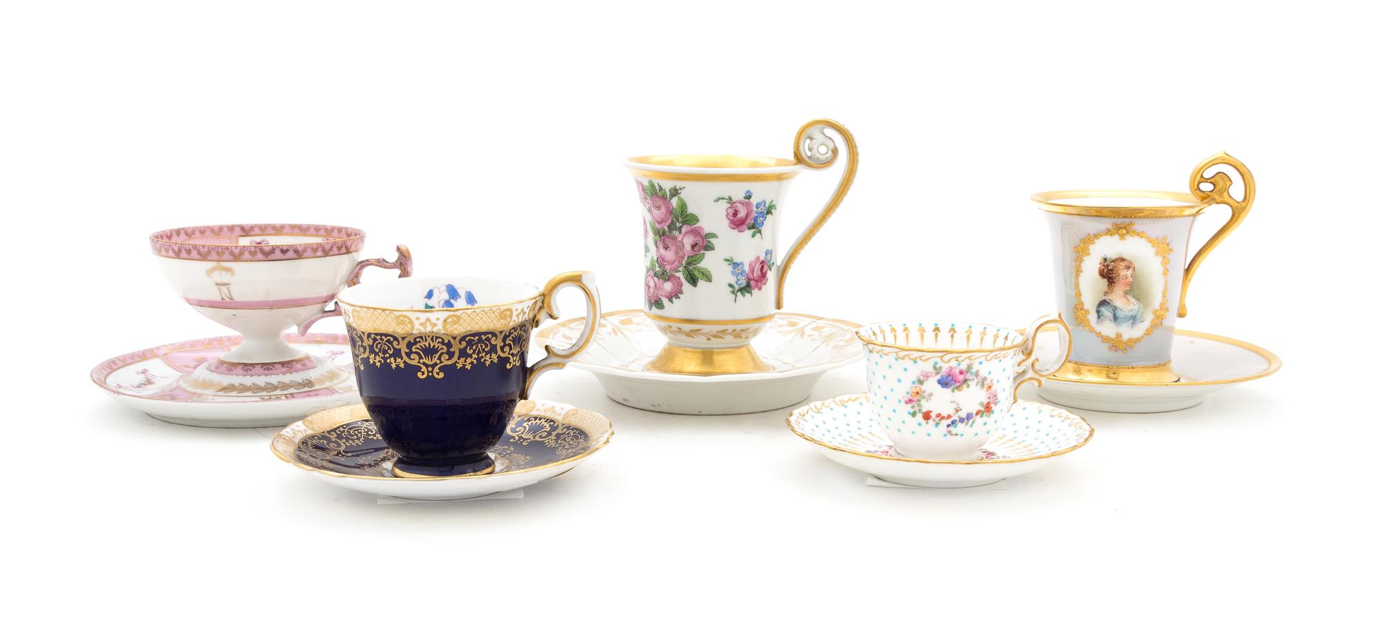 A Group of Porcelain Cups and Saucers Height of tallest 4 3/4 inches.